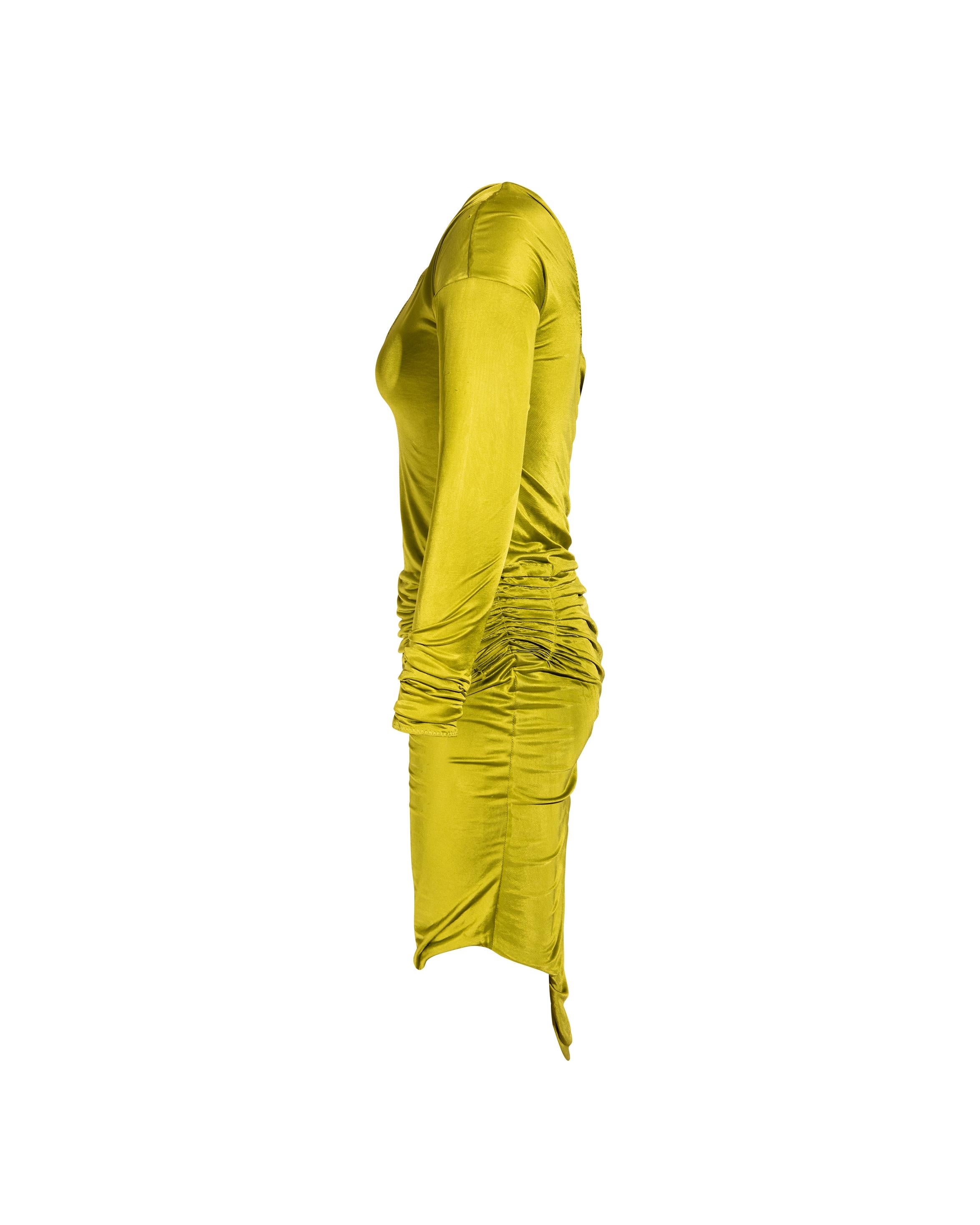 c. 2003 Gucci by Tom Ford asymmetrical chartreuse long sleeve dress. Chartreuse v-neck bodycon dress with asymmetrical strap across chest, ruching at side and asymmetrical hem.