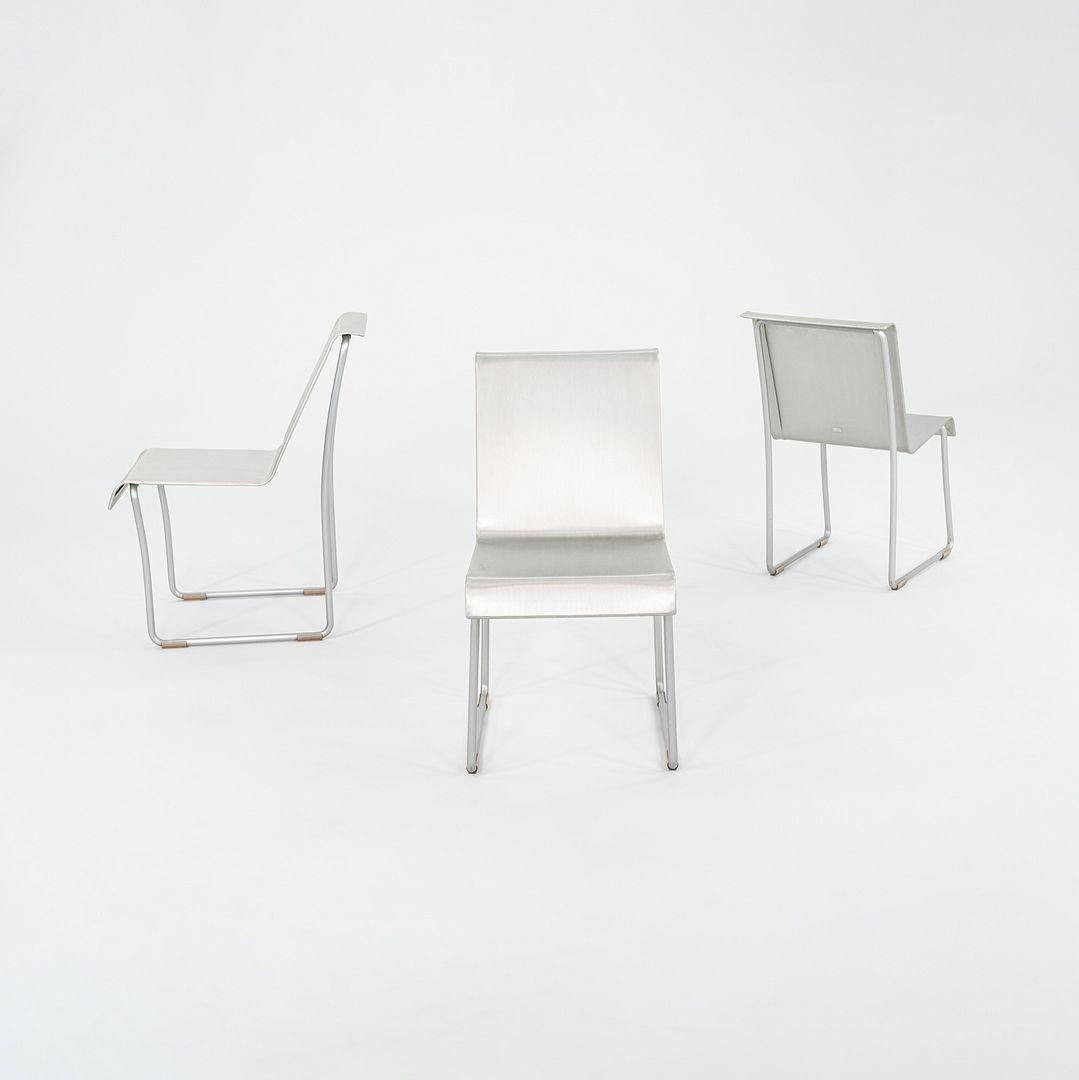 This is a 'Superlight' Recycled Aluminum Chair, designed by Frank Gehry for Emeco in 2004. These examples date to around the same time. The listed price includes one chair, and we have three chairs available for purchase. They are composed of