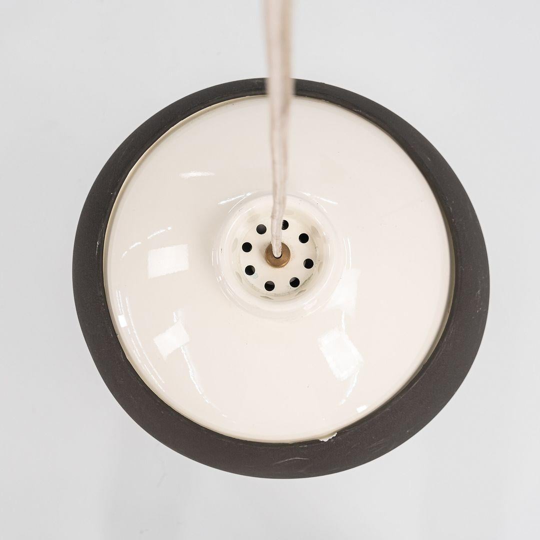 This is a Model 2129 pendant lamp, originally designed by Gino Sarfatti in 1969. This particular example was produced by Flos in Italy C. 2010. This pendant lamp is comprised of an acrylic structure, aluminum reflector, and brass mount. 
 
 The