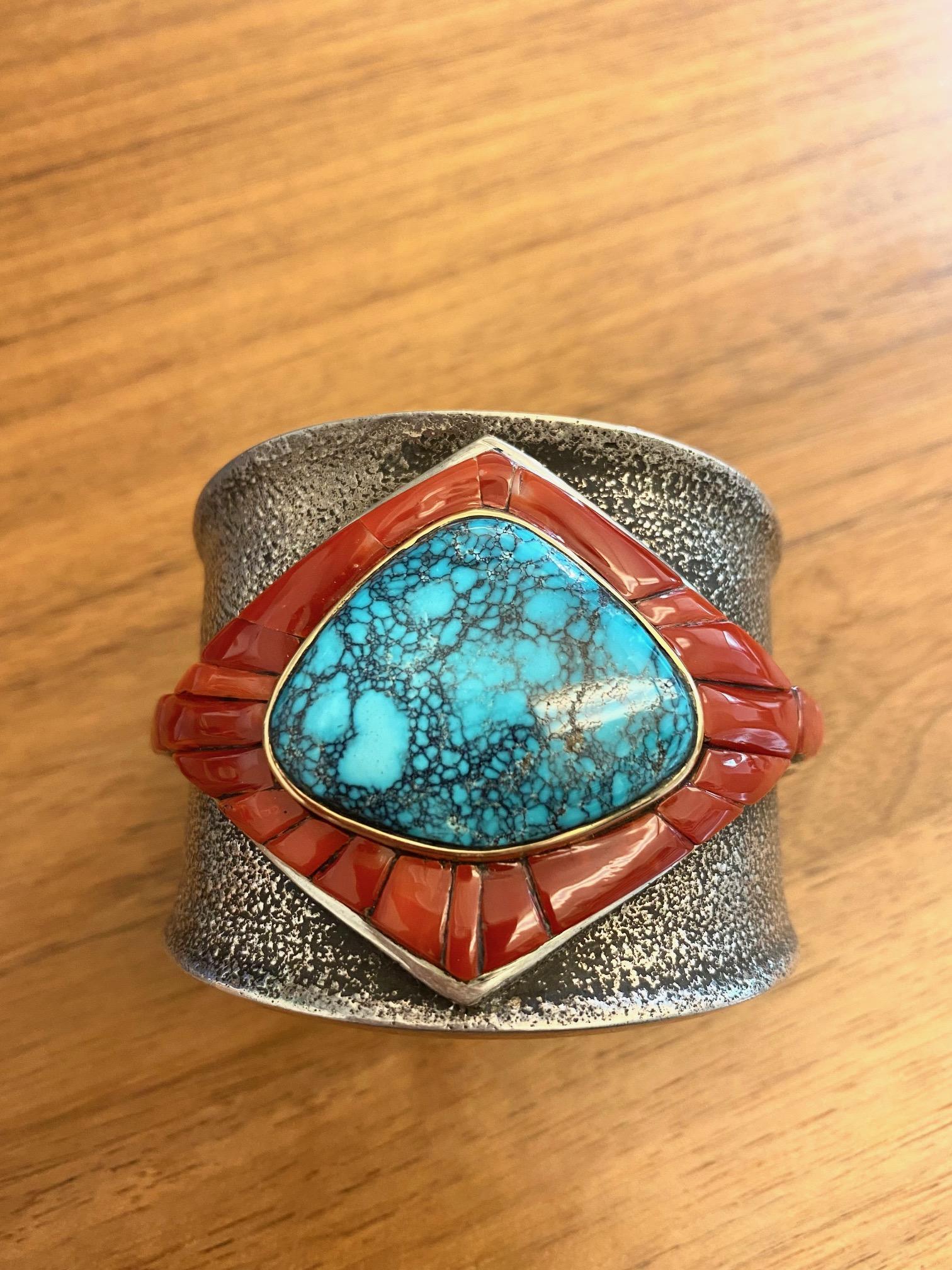A Red Mountain turquoise, coral, 14 karat yellow gold and tufa cast sterling silver cuff, by Edison Cummings (Navajo), 2015. Stamped E Cummings 14k. This cuff was bought directly from the artist and has never been worn. 
Inner circumference of cuff