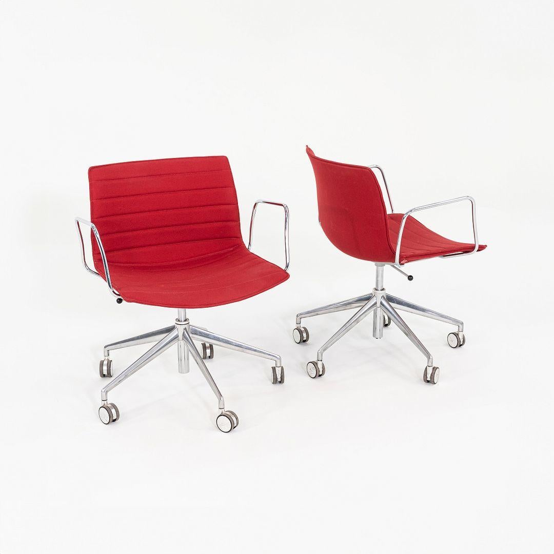 These are Catifa 53 Desk Chairs with armrests, originally designed by Lievore Altherr Molina in 2013. These particular examples were produced by Arper in Italy C. 2020. The chairs are comprised of a 5 star aluminum pneumatic base, steel armrests,