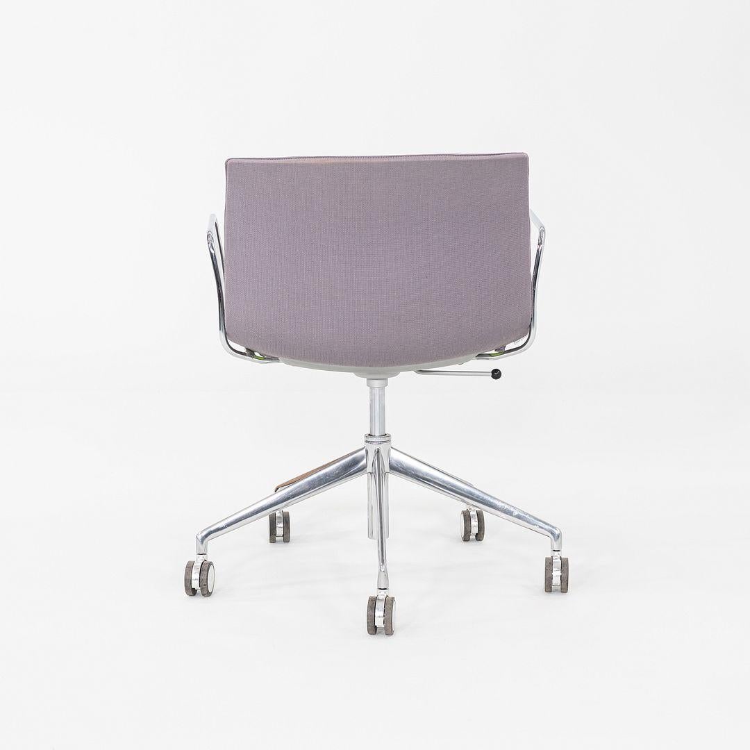 This is a Catifa 53 Desk Chair with armrests, originally designed by Lievore Altherr Molina in 2013. This particular example was produced by Arper in Italy C. 2020. The chair is comprised of a 5 star aluminum pneumatic base, steel armrests, and a