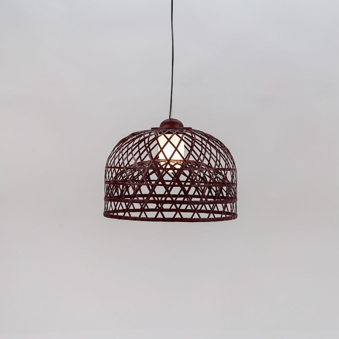 Listed for sale is an Emperor Suspended Lamp made with a red bamboo rattan shade and glass diffuser. The lamp was designed by Neri and Hu and produced by Moooi¬†in the Netherlands. It dates to circa 2022 and is guaranteed as authentic.¬†Condition is