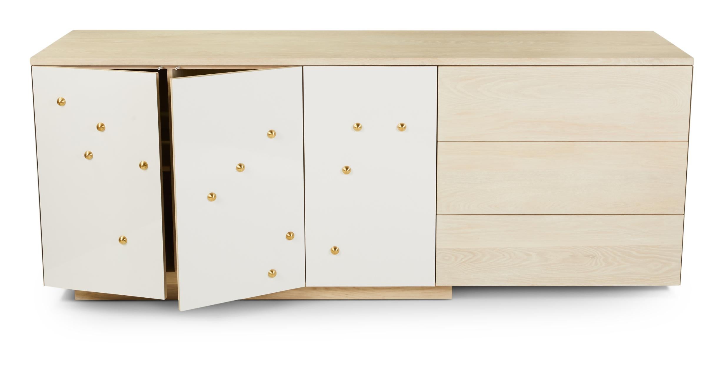 C-210WB is a variation on the studio's popular C-210 model. The counter-top, drawers and interior are made from white oak with a bleached and white stained oil finish. The remainder of the piece is clad in powder-coated white aluminum and features