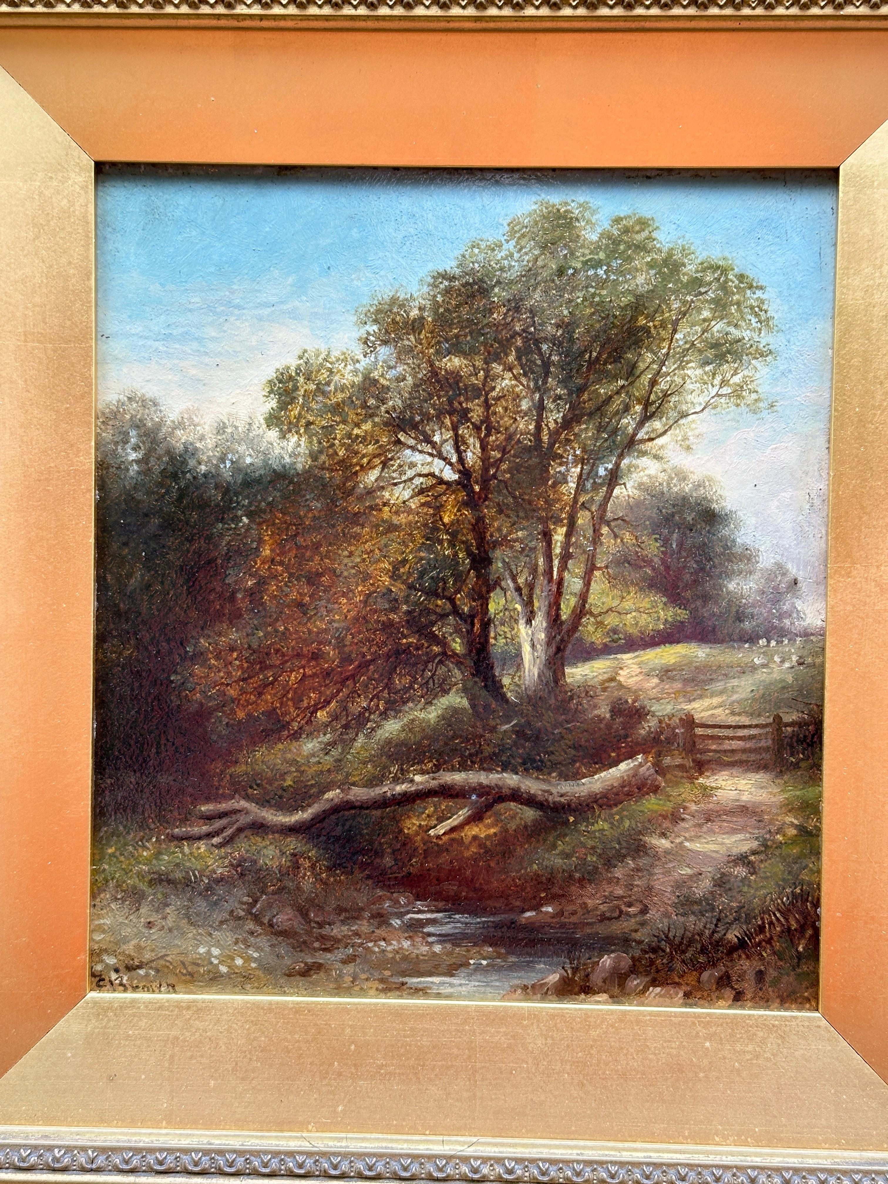 19th century English landscape with Oak trees, a stream and sheep on a pathway - Painting by C. Brown