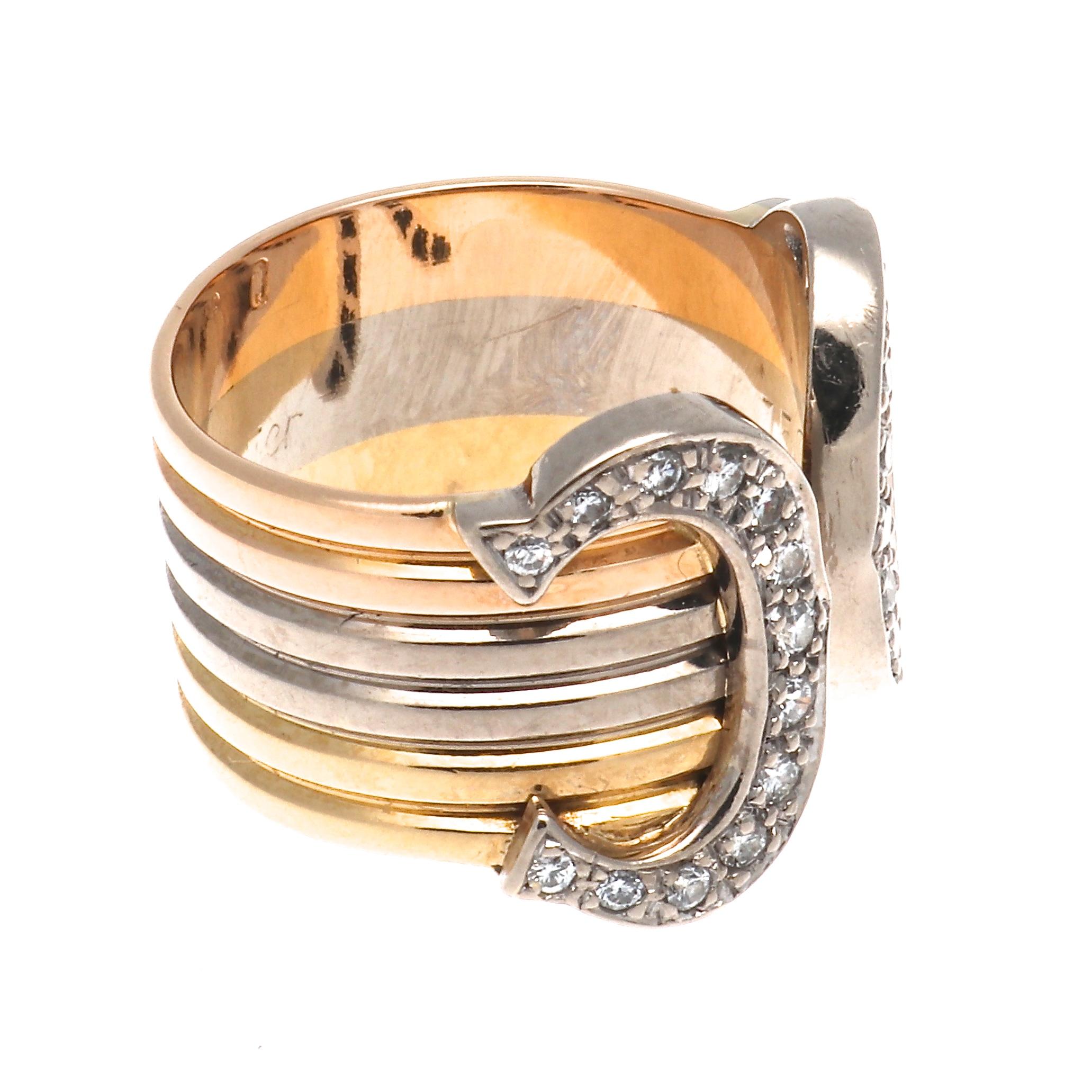 Cartier signature C ring bestows pure elegance. A discreet initial of such unique purity. Featuring C's of diamonds wrapped in a tricolor gold band. Signed Cartier, serial number.

Ring size 48 or 4-1/2.