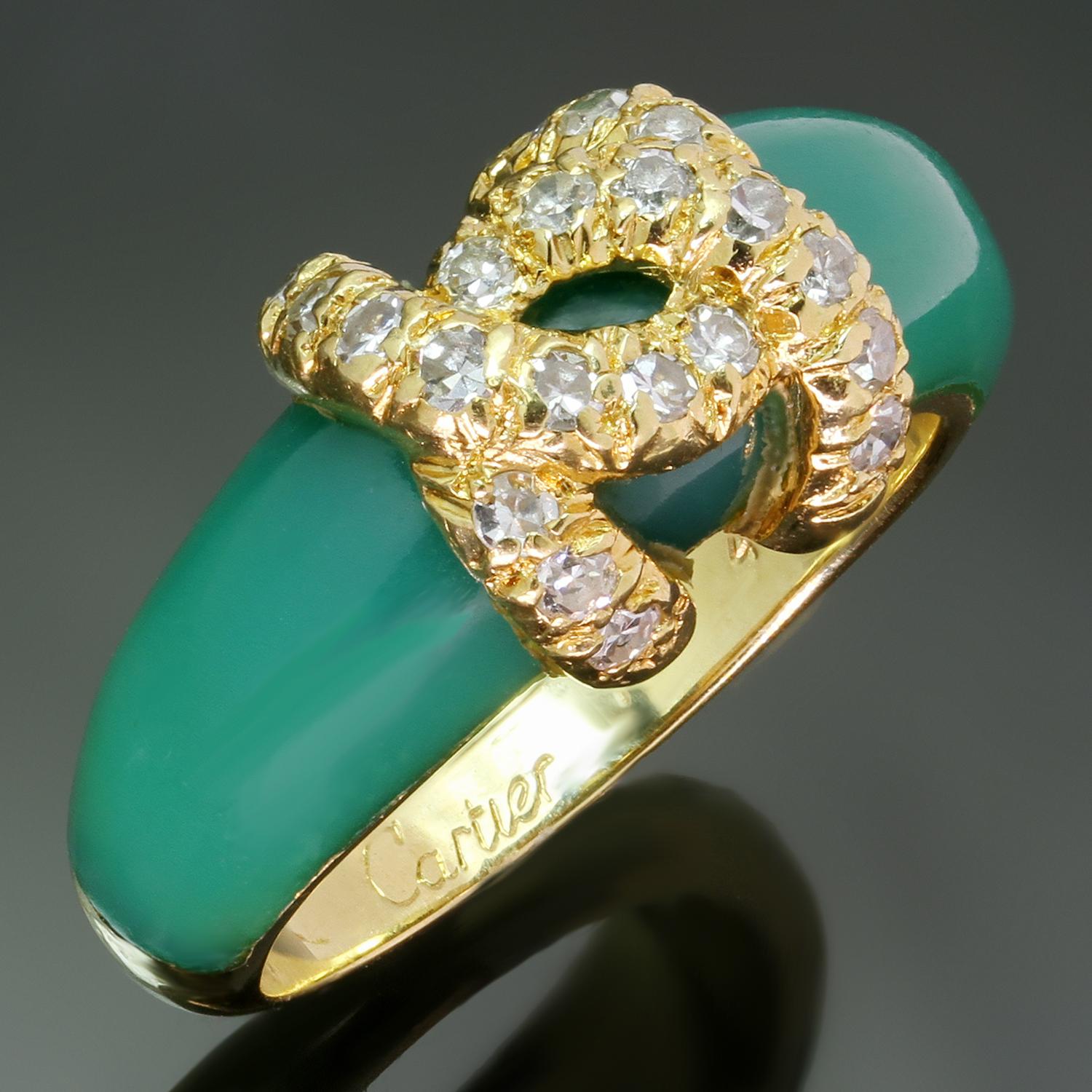 This authentic Cartier ring from the iconic C de Cartier collection is crafted in 18k yellow gold and green rhodochrosite and features a double C logo motif set with 20 round diamonds weighing an estimated 0.25 carats. Made in France circa 1980s.