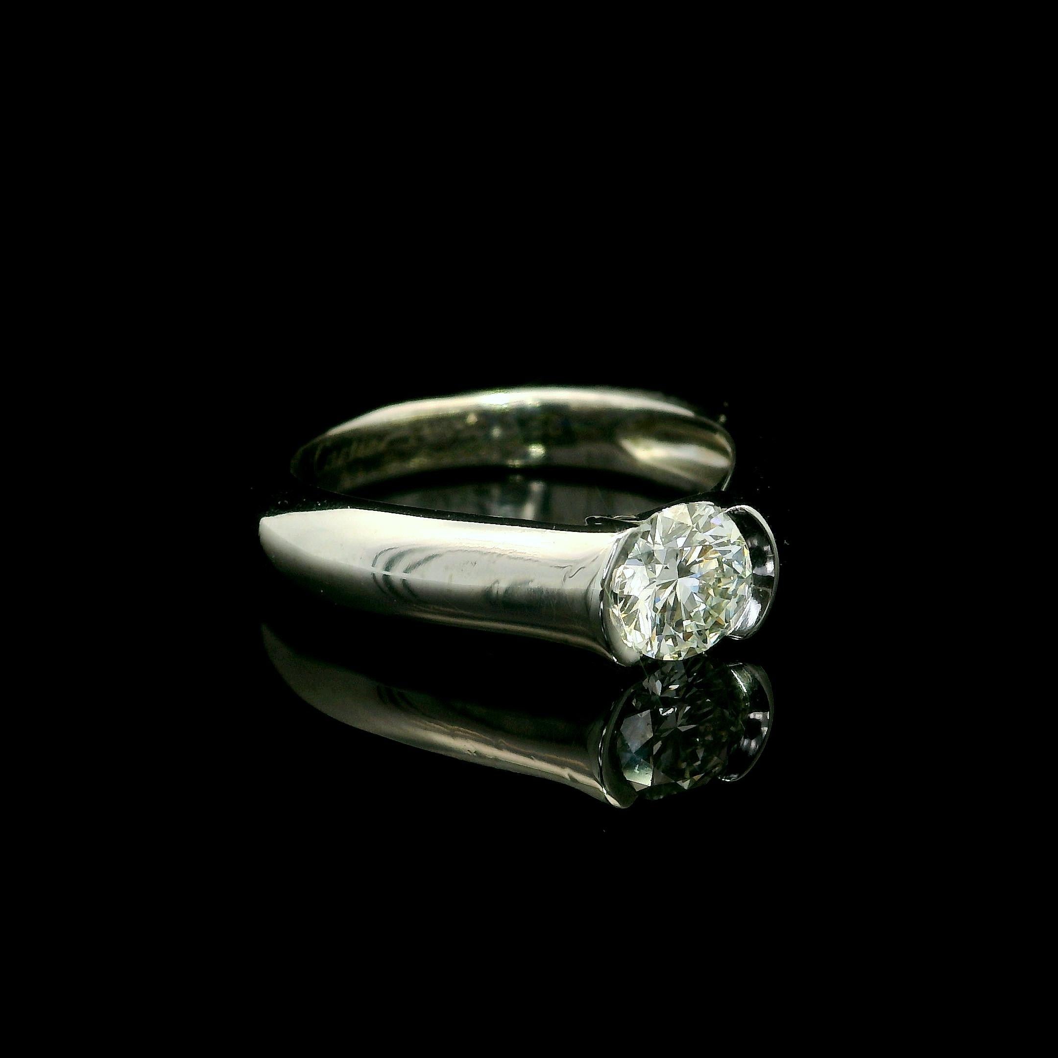 --Stone(s):--
(1) Natural Genuine Diamond - Round Brilliant Cut - Half Bezel Channel Set - VS Clarity - F/G Clarity - 0.56ct (exact - stamped)
Total Carat Weight: 0.656 (exact)

Material: Solid Platinum
Weight: 6.55 Grams
Ring Size: Size 49 - 4.5
