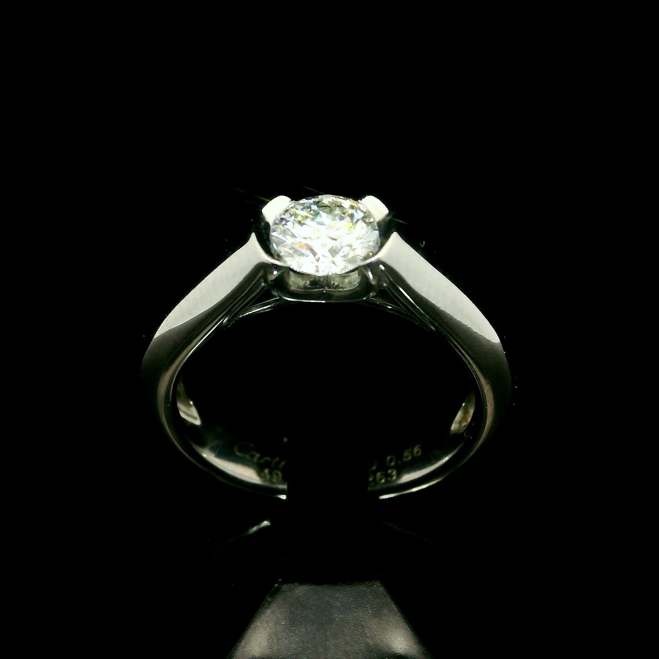 C De Cartier Platinum .56ct Half Bezel Diamond Solitaire Engagement Ring Size 49 In Excellent Condition For Sale In Montclair, NJ