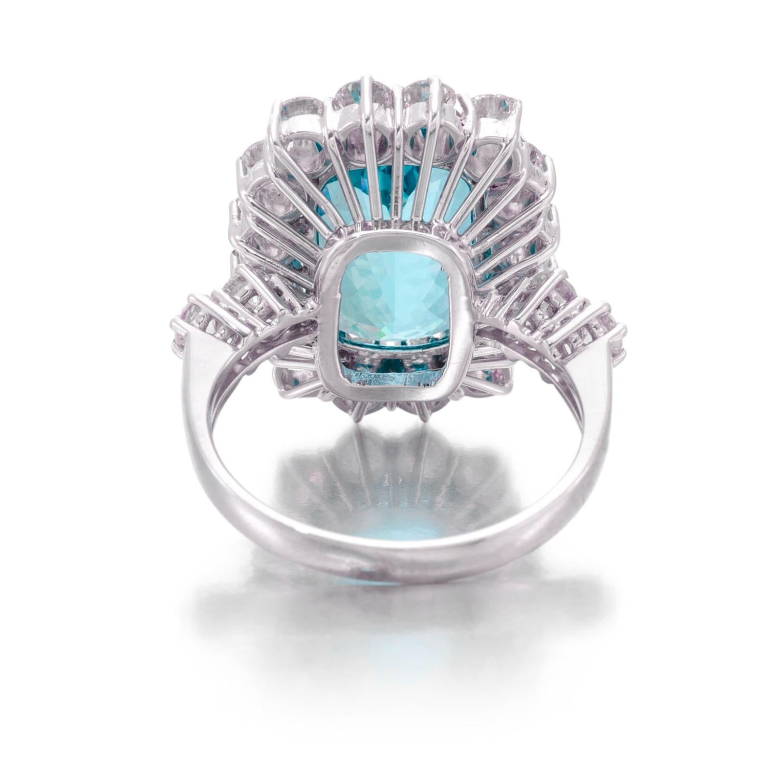 C. Dunaigre 17.29 Carat Paraiba Tourmaline Diamond Ring, a stunning showcase of luxury and artistry. This striking piece features a captivating Paraiba tourmaline, known for its vibrant turquoise hues and exceptional clarity, undeniably making it a