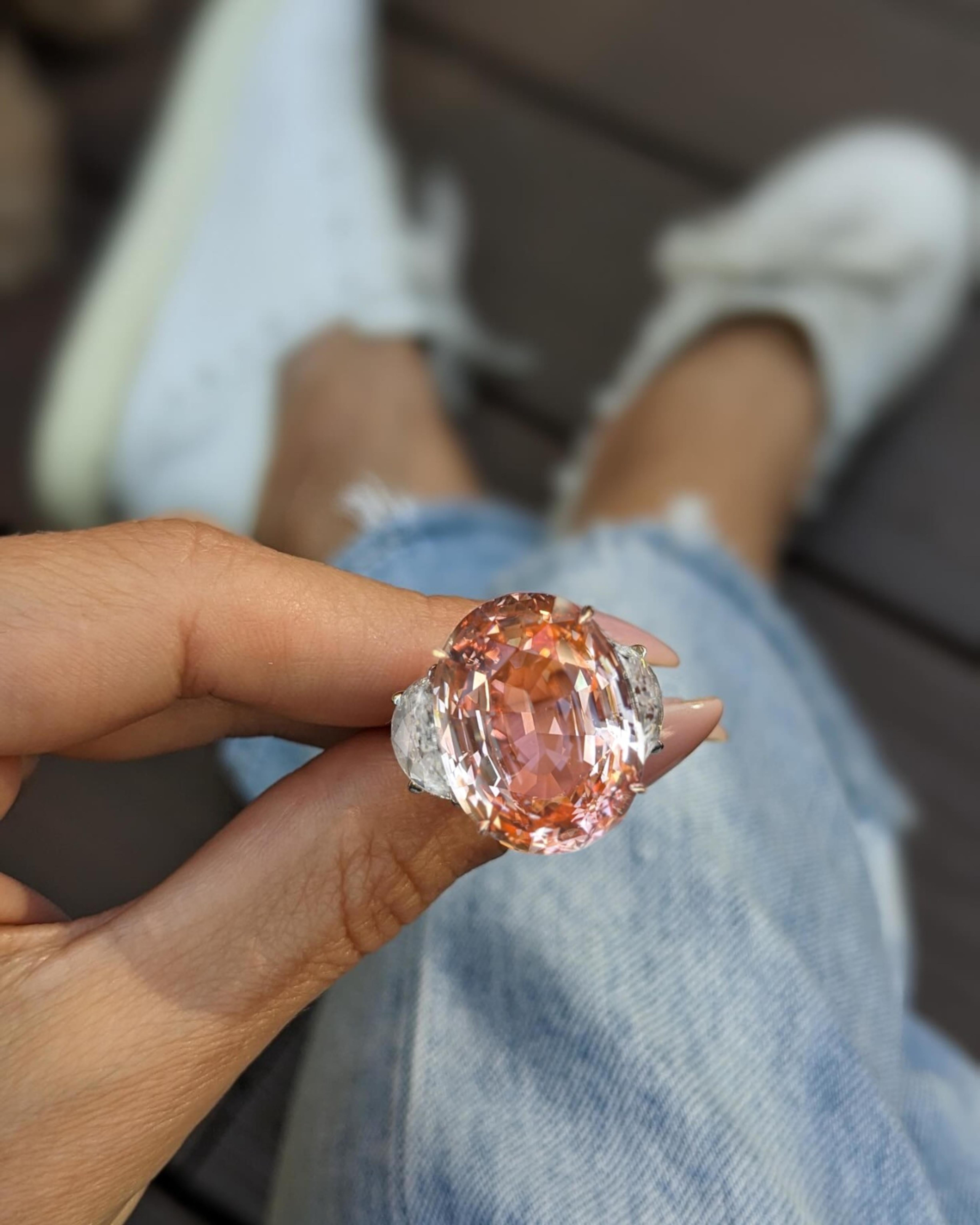 8.08-carat Padparadscha sapphire ring, an extraordinary piece of fine jewelry that showcases unparalleled beauty and rarity. This exceptional Padparadscha is C. Dunaigre certified, affirming its stunning pinkish-orange hue, which is highly sought