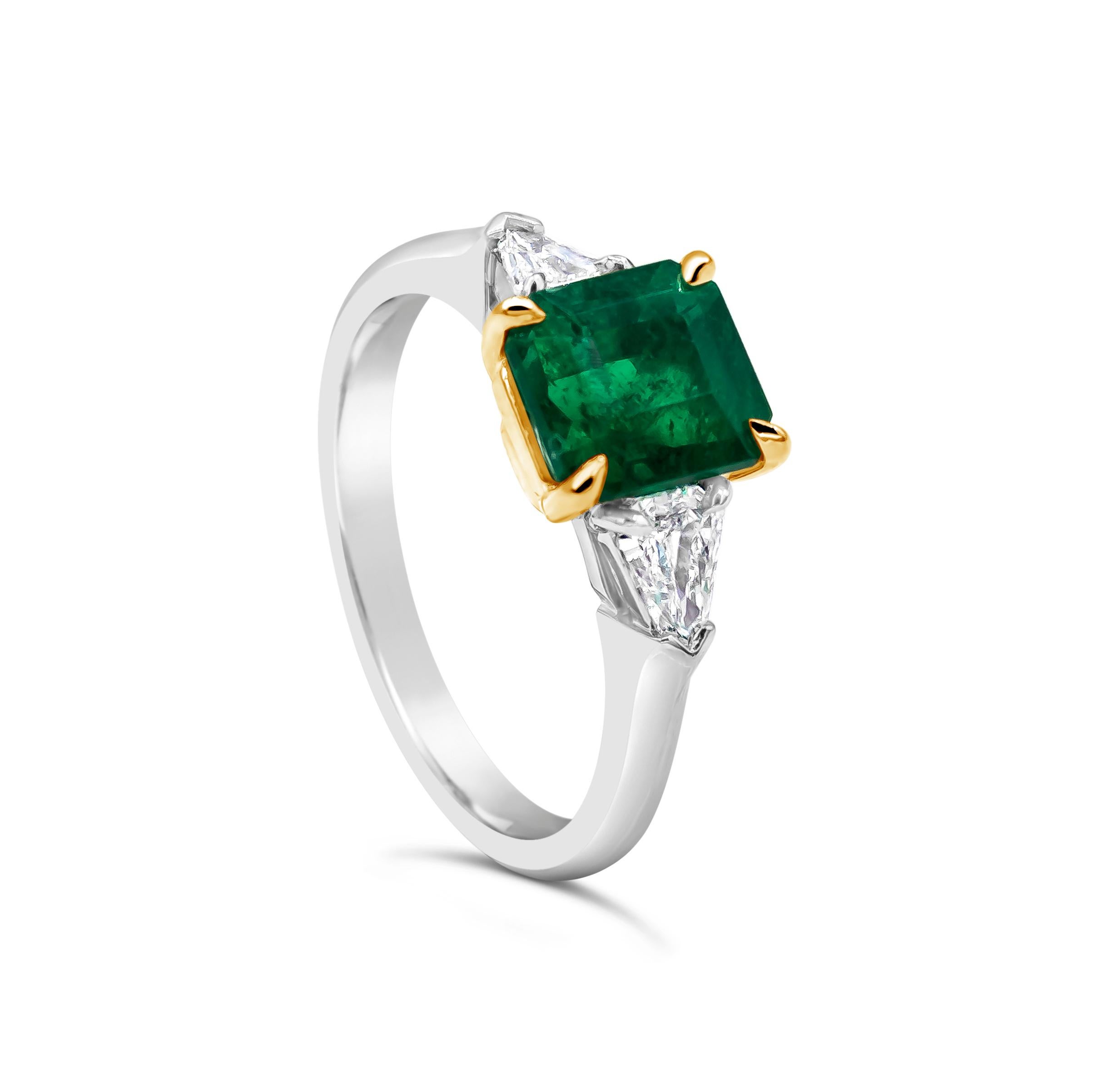 Features a color-rich 1.48 carat Colombian emerald that C. Dunaigre certified as vivid green color, with minor treatment. The emerald is flanked by two bullet shape diamonds in a polished platinum mounting.

Style available in different price