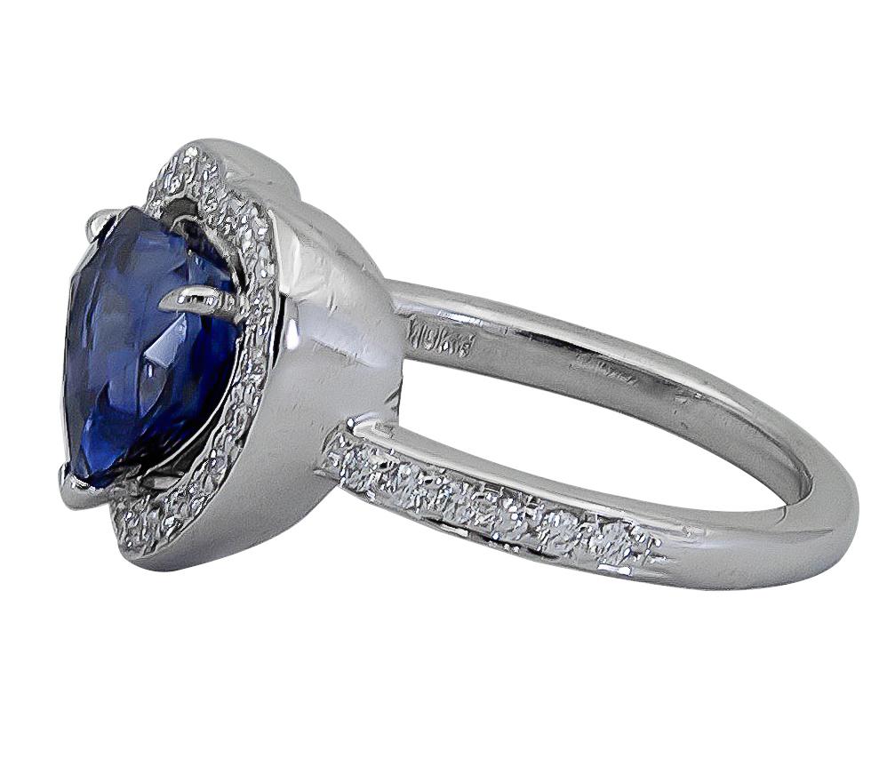Showcasing a vibrant royal blue sapphire, heart shaped, set in a beautiful floating halo accented with round brilliant diamonds. Made in platinum.
Blue sapphire weighs 2.94 carats and is certified as Vivid Blue color, Madagascar origin.
Diamonds