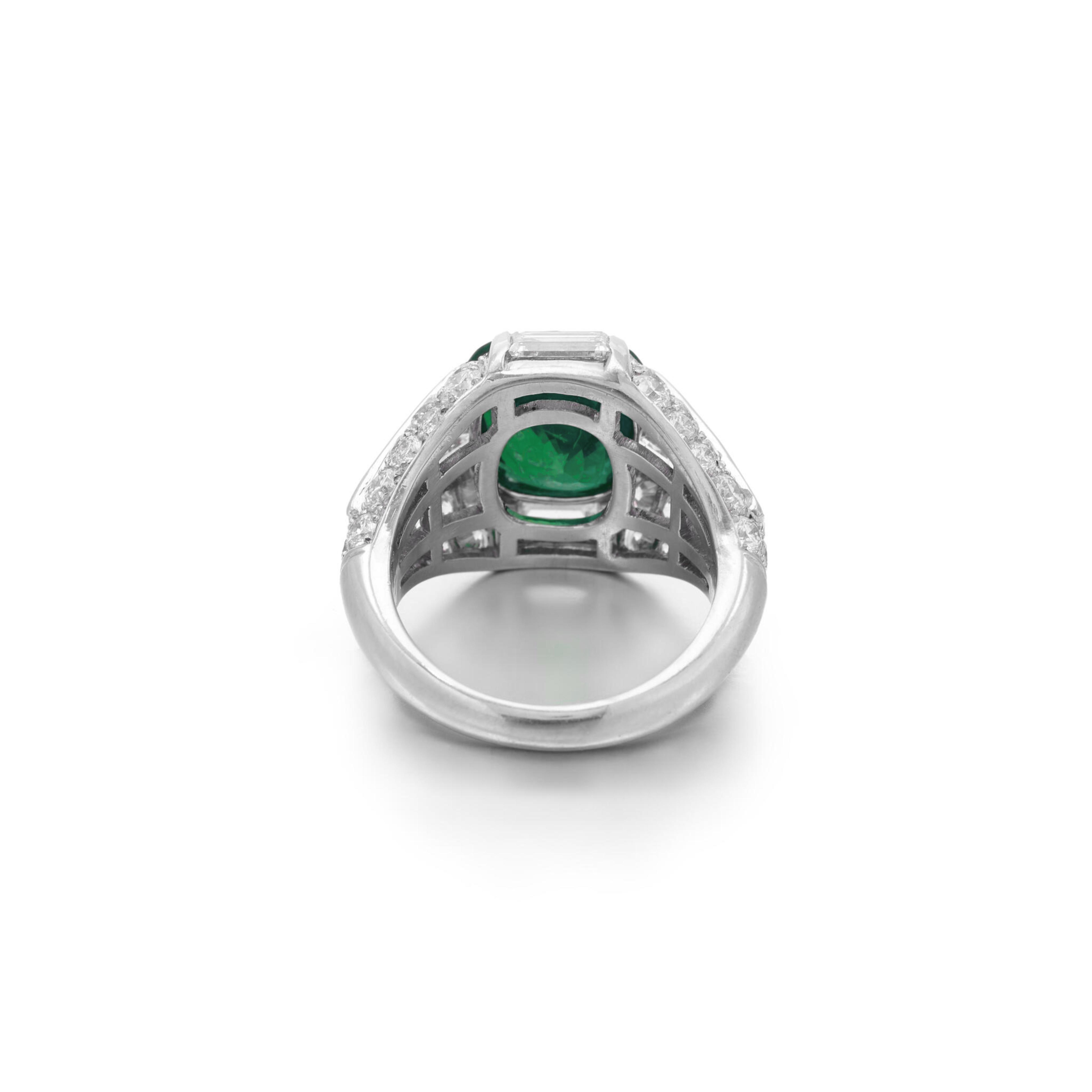 Colombian emerald ring, featuring a radiant 6.56-carat cushion-shaped emerald that showcases the rich depth of its legendary color. This enchanting piece is expertly enhanced by minor oil treatment, certified by renowned gemologist C. Dunaigre,