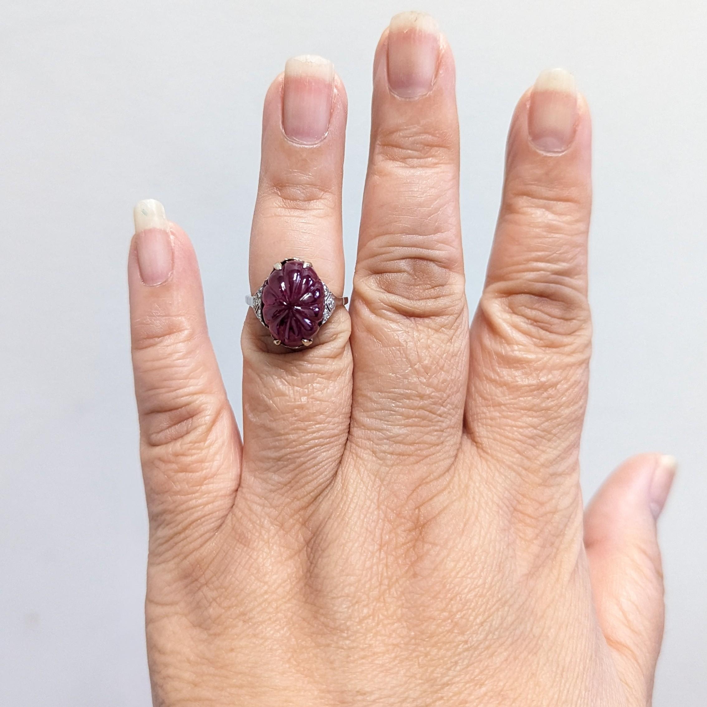 Beautiful 11.35 ct. unheated carved Burma ruby.  Ring size is 6.5.  Handmade in platinum.  C. Dunaigre certificate is included.