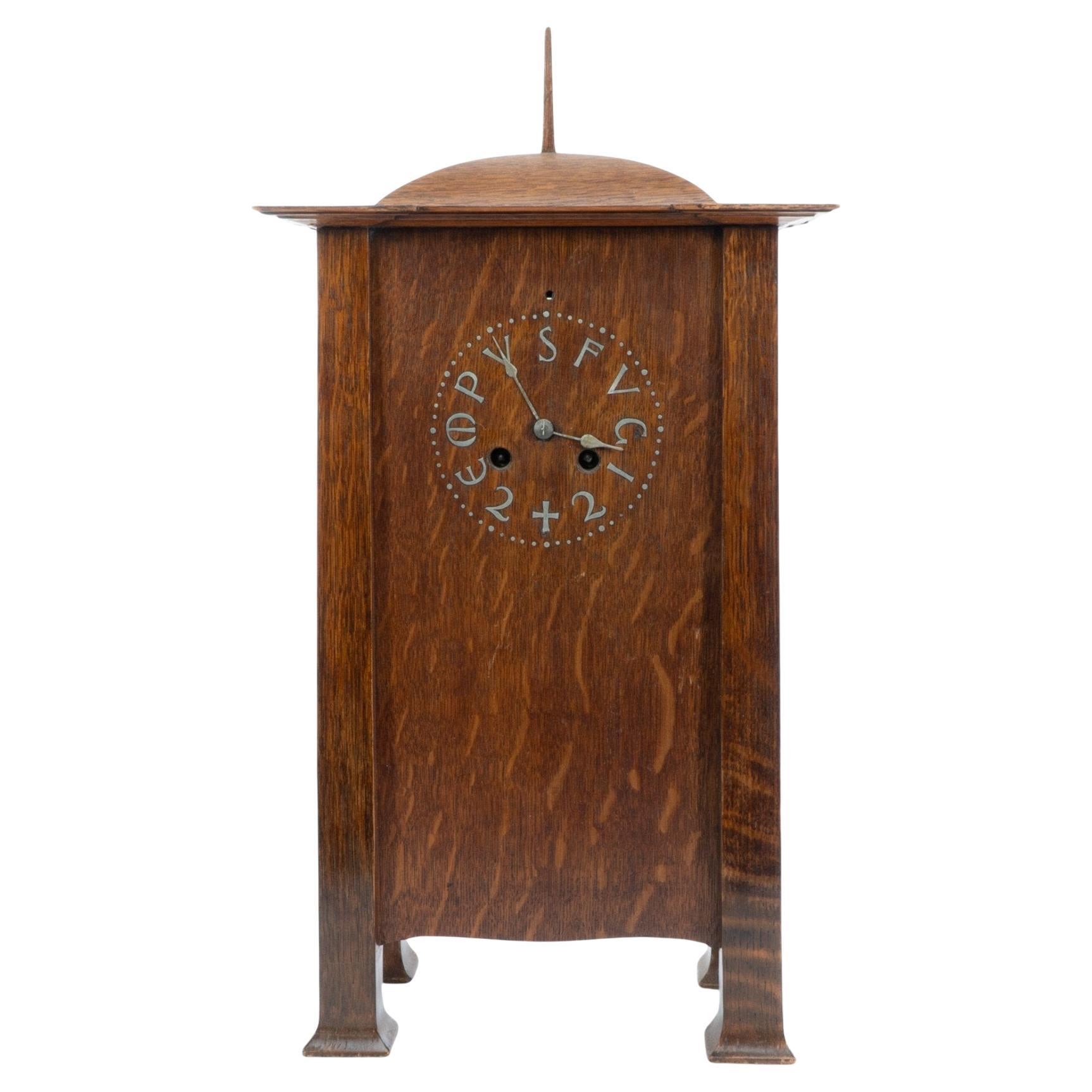 C. F. A. Voysey (1857–1941). A rare Arts and Crafts oak mantel clock For Sale