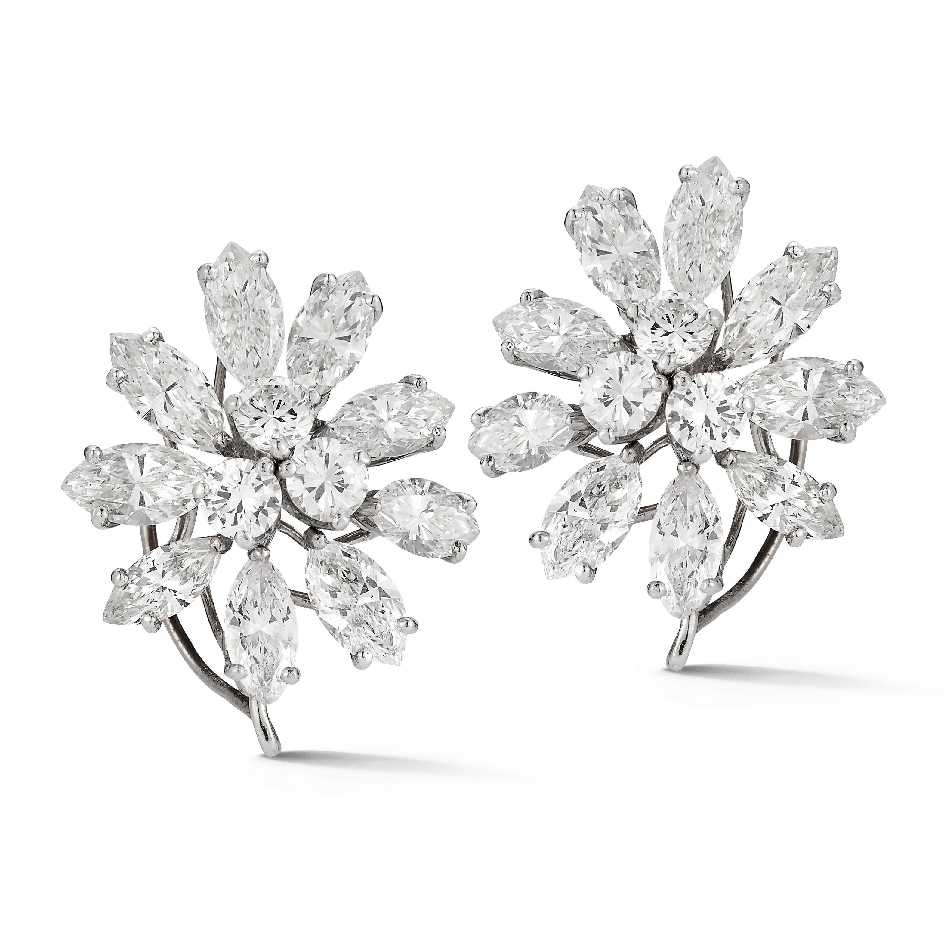 Cluster Diamond Earrings

A pair of platinum earrings set with 6 round cut diamonds and 18 marquise cut diamonds. 

Total Approximate Diamond Weight: 7.14 carats

Length: 0.75