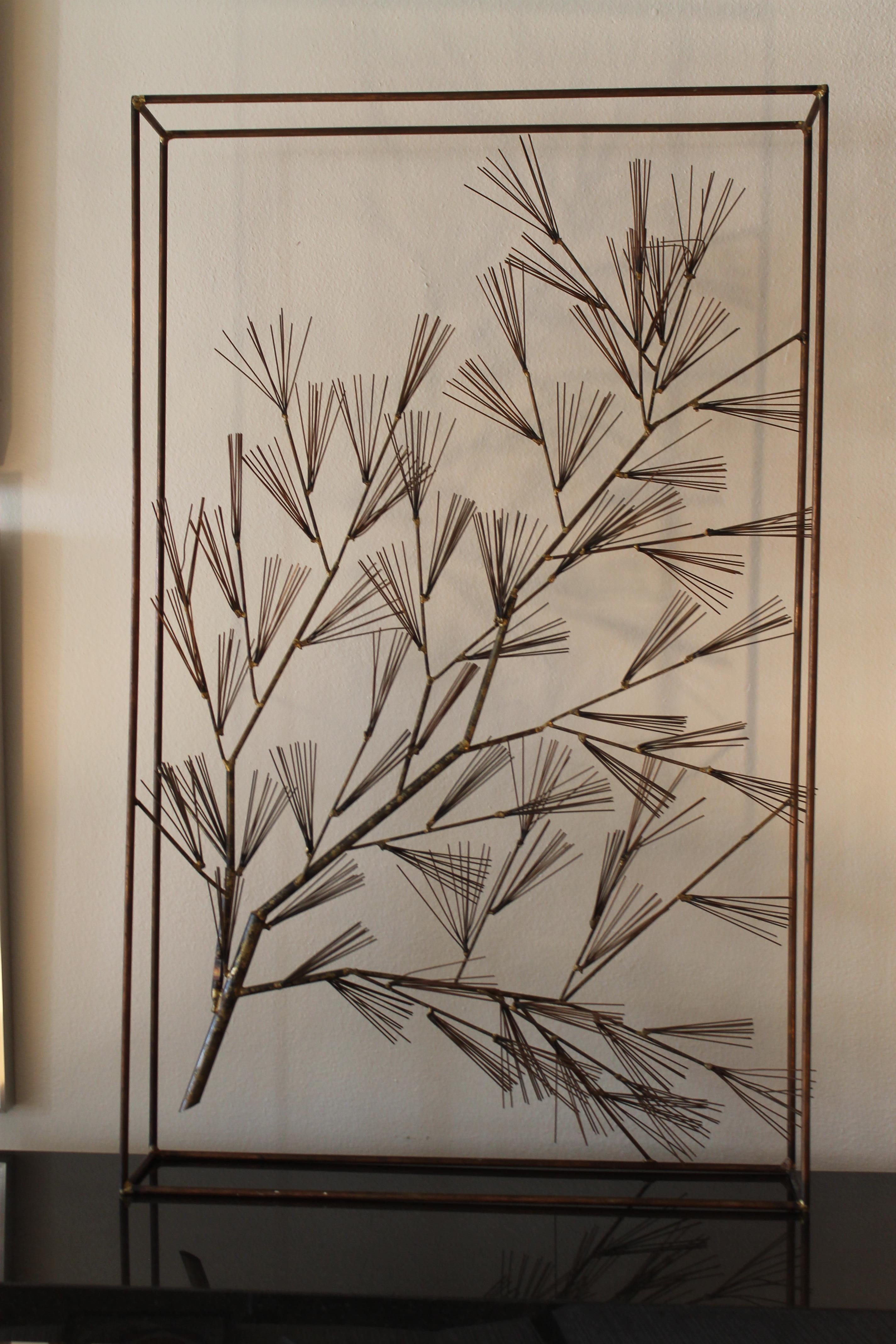 C. Jere pine tree sculpture in frame. Sculpture is made of steel with a bronzed/copper patina. Sculpture measures: 30