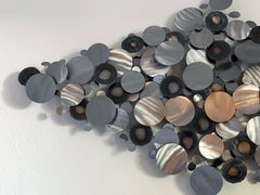 C. Jeré Artisan House metal wall sculpture of circles or raindrops