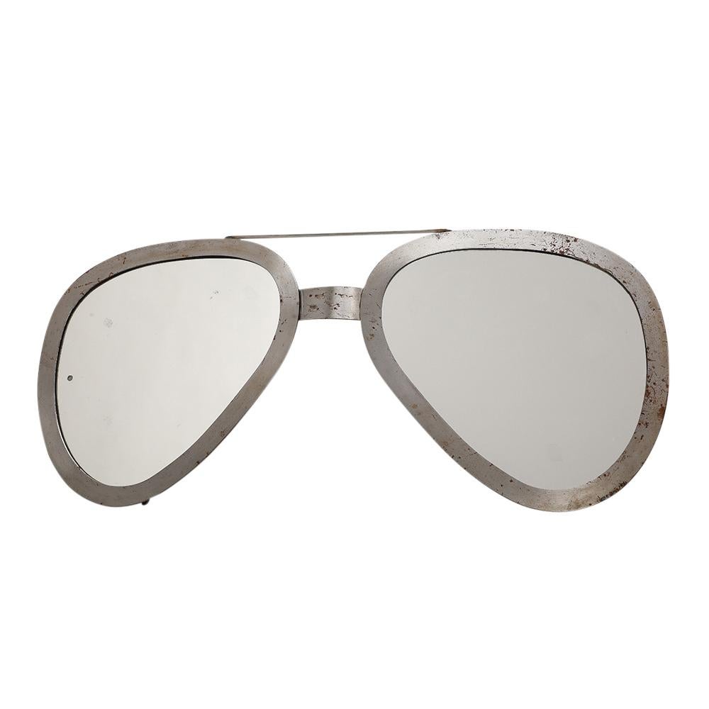 C. Jere Aviator Sunglasses Mirror, Brushed Chrome, Signed. Large wall mirror sculpture in original condition with scattered oxidation to the frame's brushed silver finish. Retains original Artisan House of California's paper hang tag which marketed