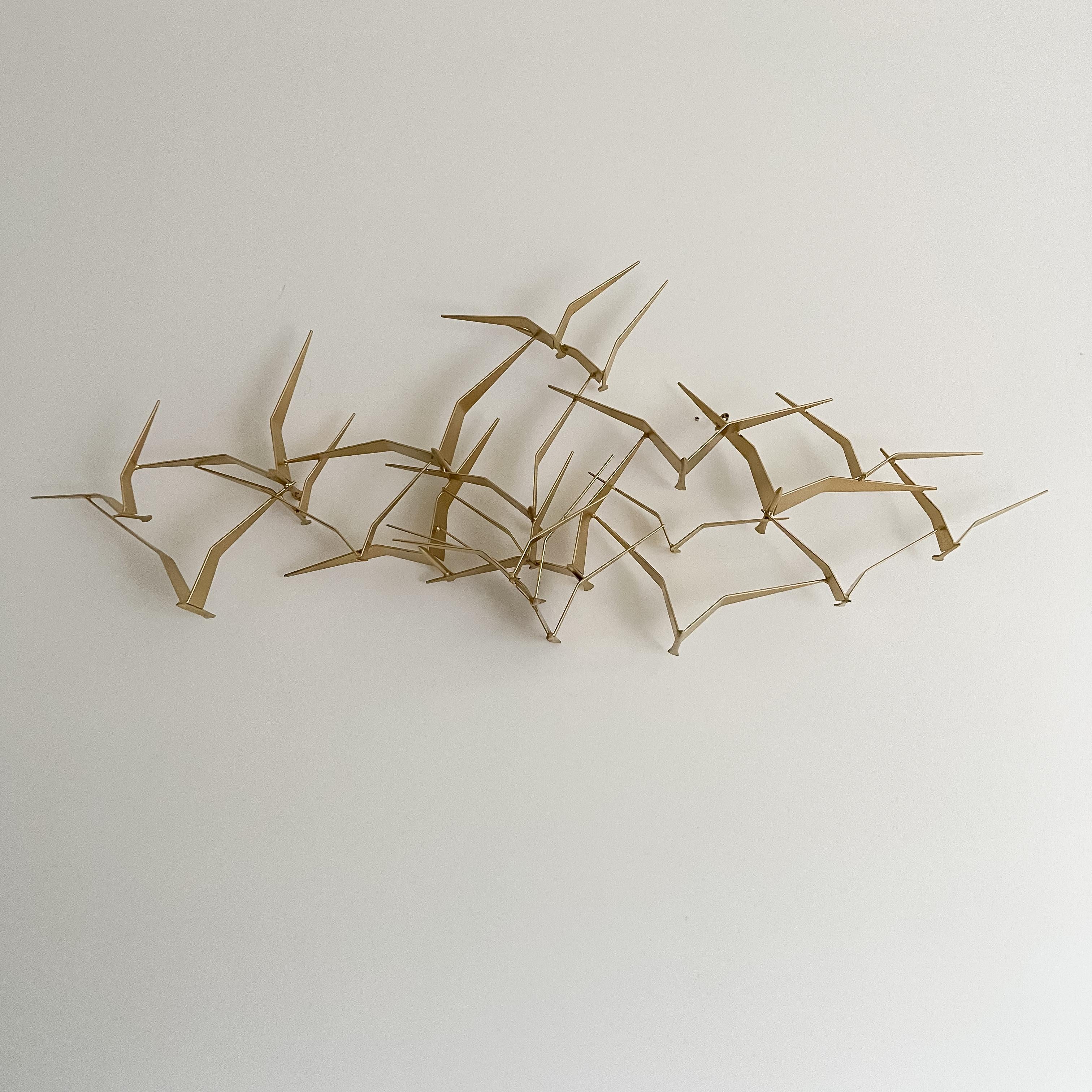 Discover a coveted piece of metal artistry by C. Jere, renowned for its unparalleled craftsmanship and timeless appeal. This sought-after creation has been painted in a luxurious brass finish, adding a touch of sophistication to any space. With