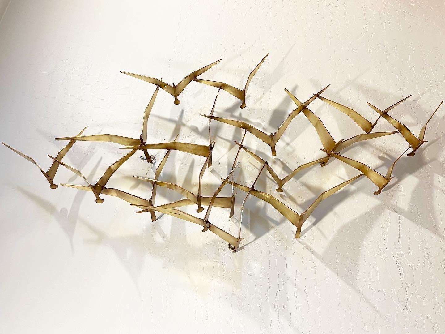 Curtis Jeré “Seagulls” brass wall sculpture. Often referred to as “Birds in Flight”. Originally designed in 1960, this particular design is a classic. Signed 1994 C. Jeré and measures 46” wide x 23” tall x 6” deep. There are three loops on the back