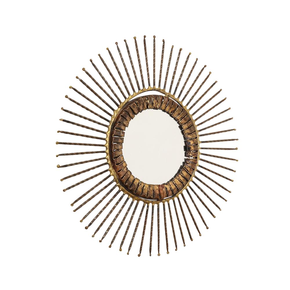 C. Jere mirror, bronze, copper, sunburst, signed. Small scale handcrafted bronze over copper sunburst mirror with twisted rebar arms. Retains its original felt backing on verso and has a circular hook for installation. Signed in black marker on edge
