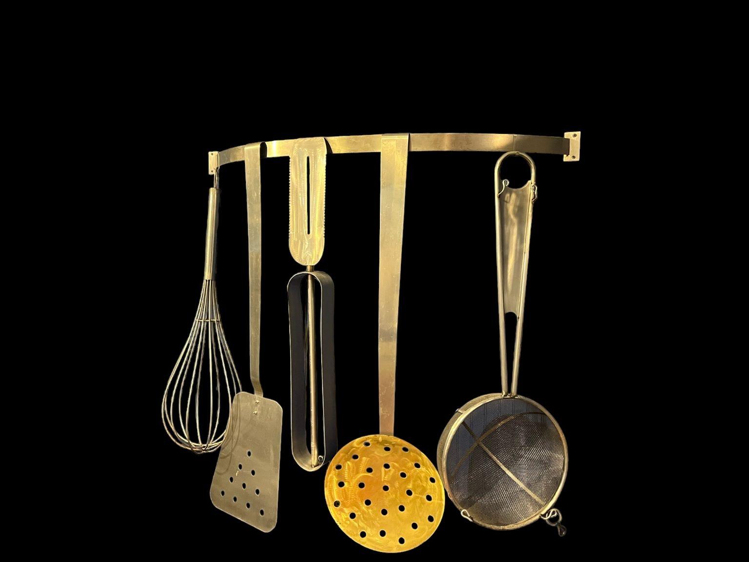 This delightfully playful set of giant cooking utensil sculptures in the style of Curtis Jere' is uncommon for its number of pieces. It includes a peeler, a spatula, a colander, a strainer and a large whisk as well as a custom wall bracket. They are