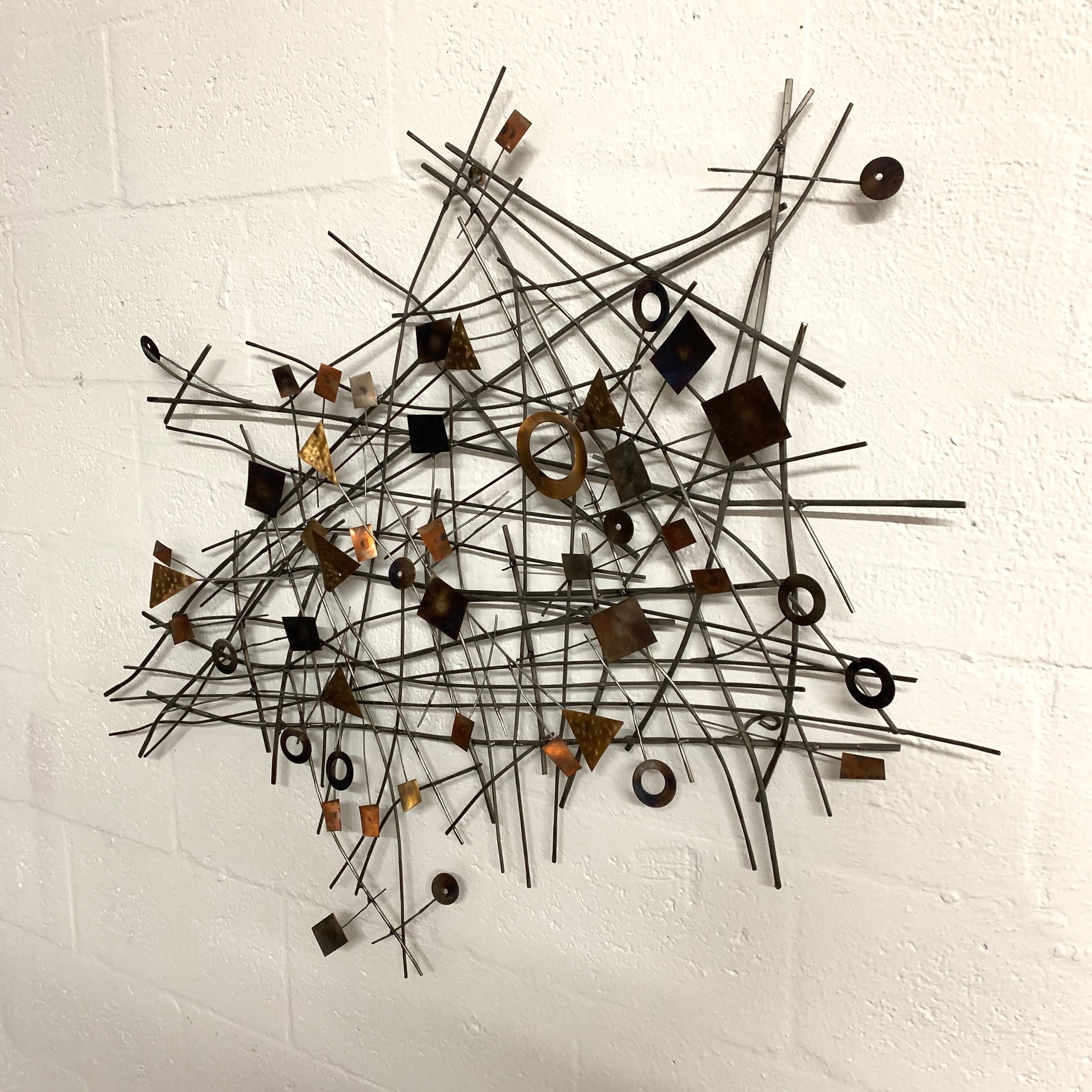 Postmodern wall sculpture rendered in mixed metals by C. Jere, 2009.