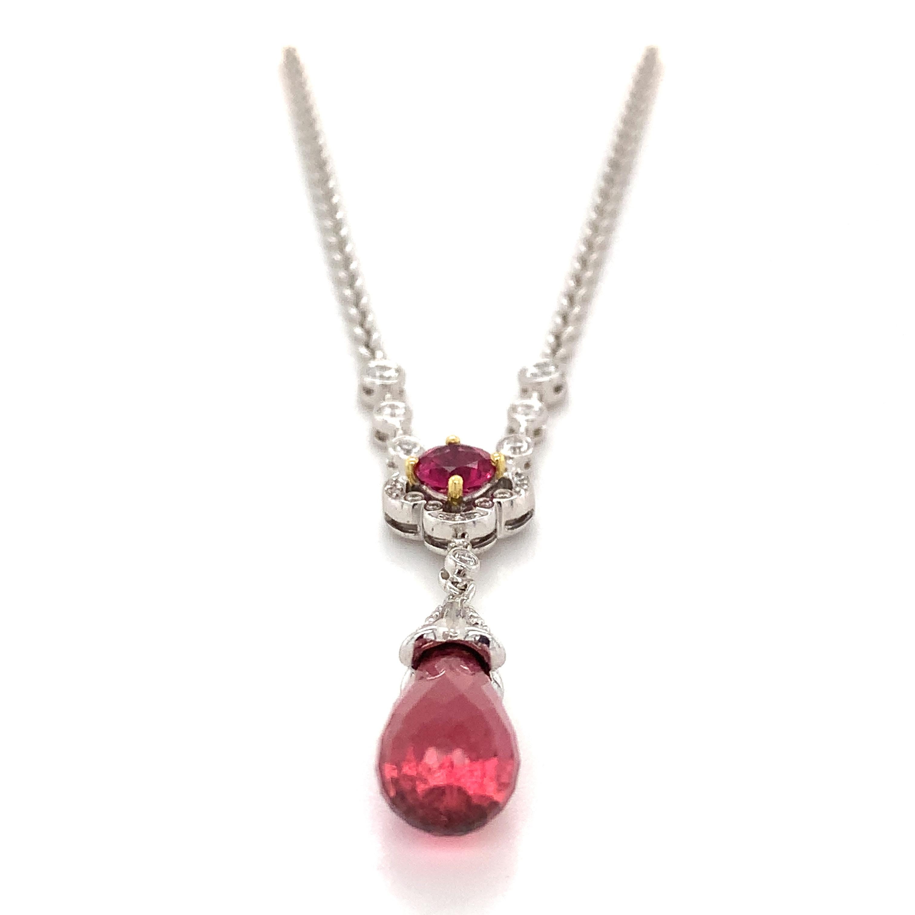 18k White Gold Pink Tourmaline And Diamond Pendant
11.6 Grams
Pink Rubies 4.76 Carats Total Weight
Round White Diamonds .4 Carats Total Weight
This is a beautiful 18k white gold ruby and diamond necklace. This necklace is created by Charles Krypell.
