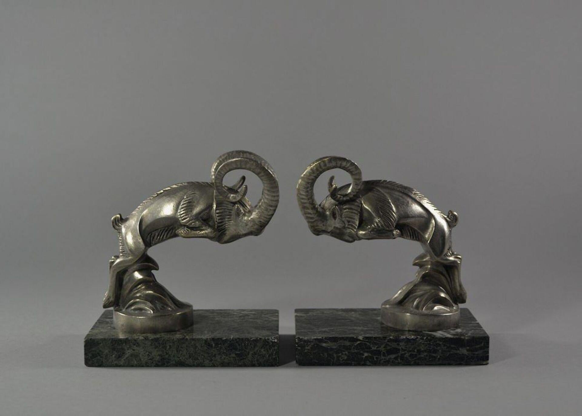 C. Laplagne car mascots

A pair of bookends with mountain goats. This figure was used in the 1920's as car mascot.
One figure signed and with Susse Paris Foundry mark.
Nickel or silver plated bronze. Excellent condition.
Each bookend L13cm l.