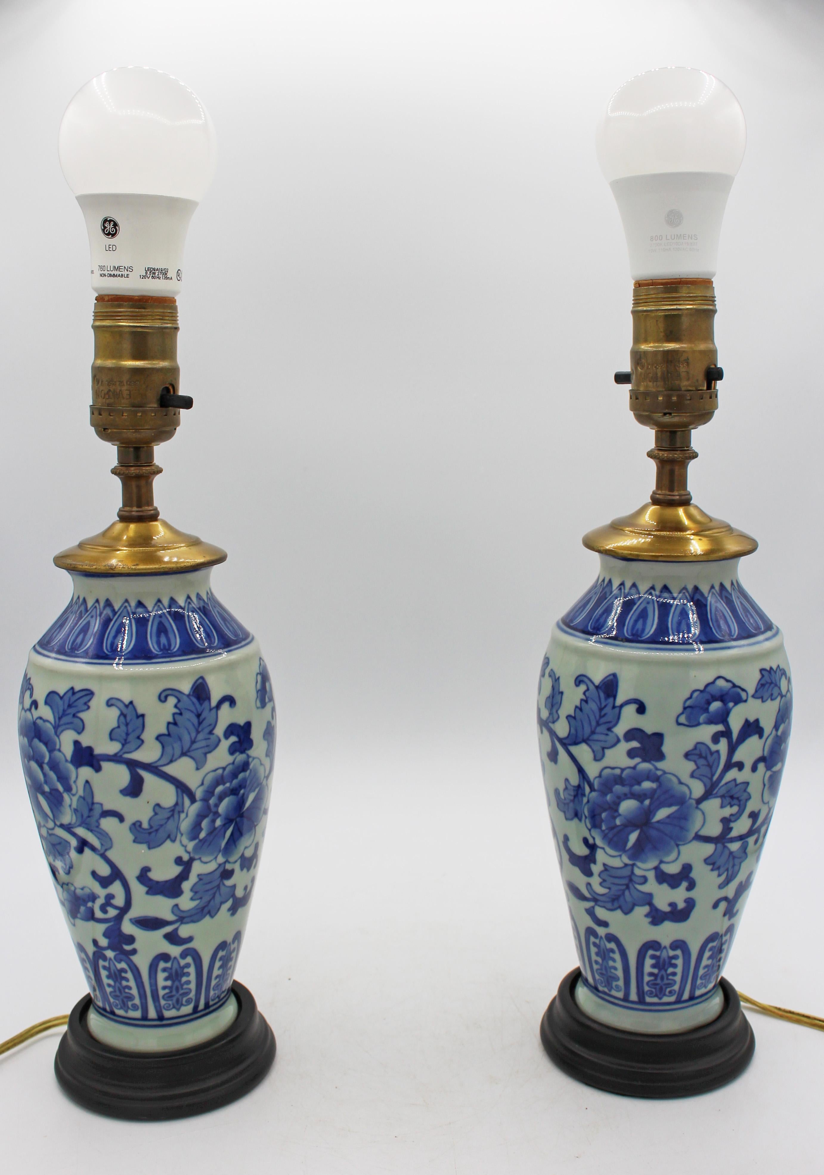 Mid-20th century pair of Chinese export porcelain vases mounted as lamps. Blue & celadon decorated with trailing peonies & attractive lappet borders. Vases 8