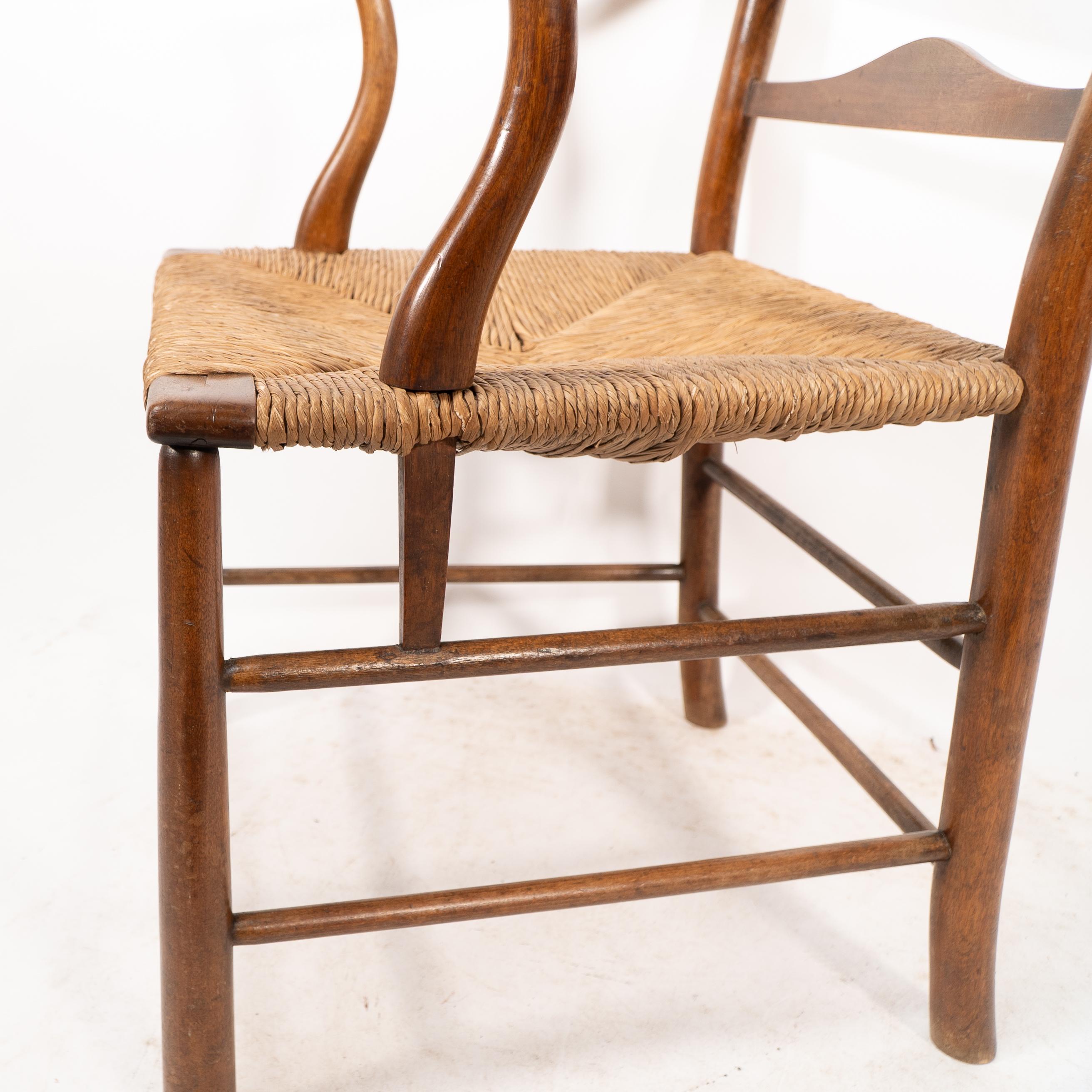 C. R. Ashbee. Un sillón Arts and Crafts con asiento de junco y respaldo de escalera en venta 5