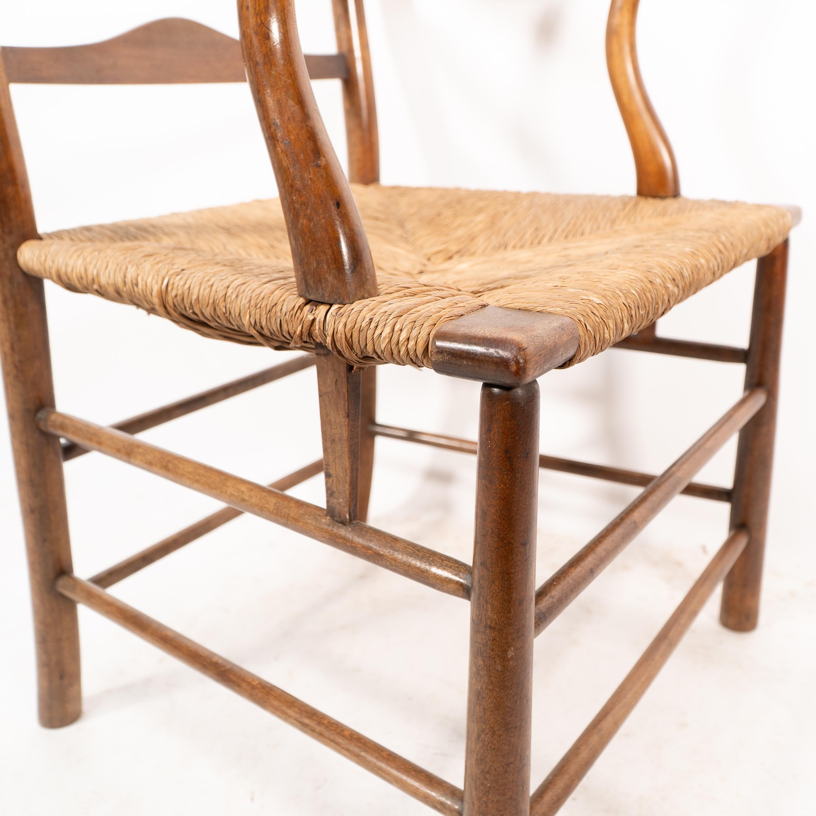 C. R. Ashbee. Un sillón Arts and Crafts con asiento de junco y respaldo de escalera en venta 6