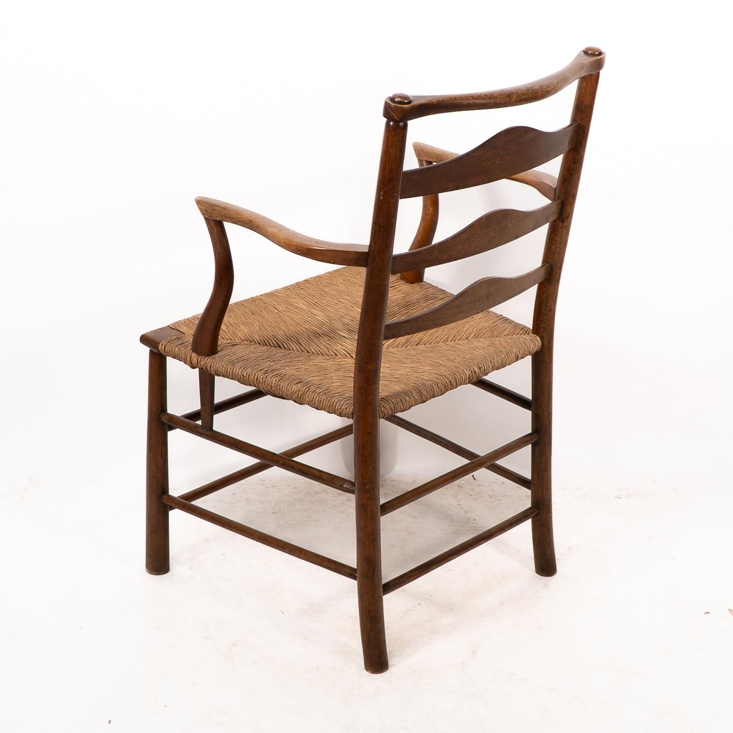 C. R. Ashbee. Un sillón Arts and Crafts con asiento de junco y respaldo de escalera en venta 7