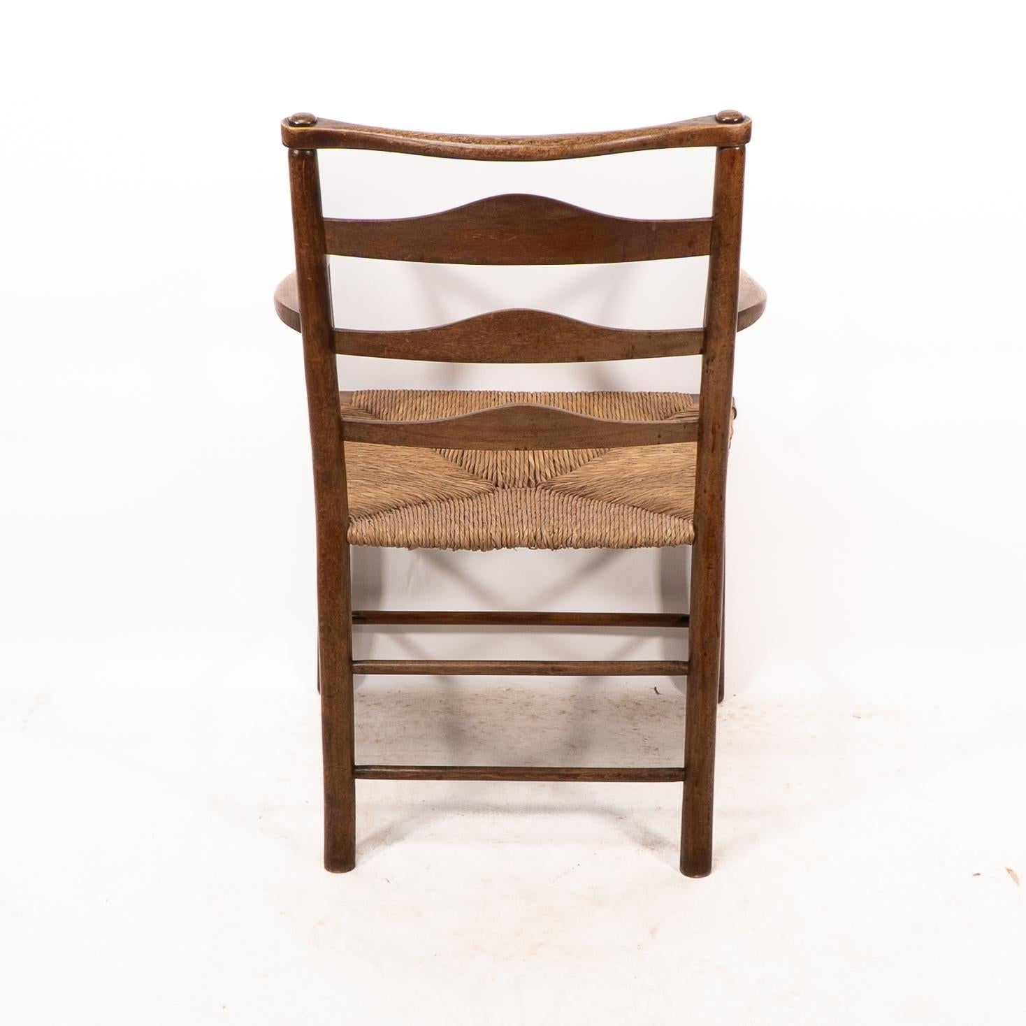 C R Ashbee. An Arts and Crafts rush seat ladder back armchair For Sale 9