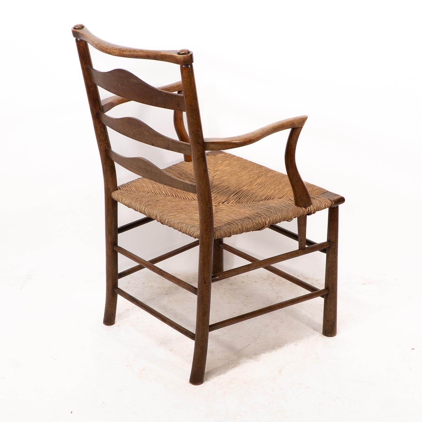 C. R. Ashbee. Un sillón Arts and Crafts con asiento de junco y respaldo de escalera en venta 9