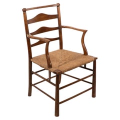 C R Ashbee. An Arts and Crafts rush seat ladder back armchair