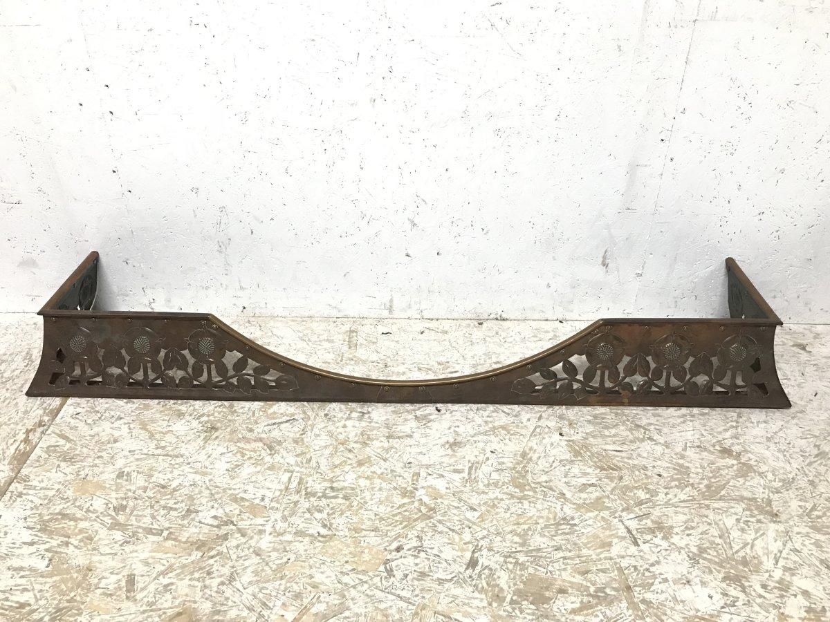 C R Ashbee, The Guild of Handicraft. Chipping Camden.
An Arts & Crafts hand made copper fireplace fender with stylised floral decoration and hand riveted construction.