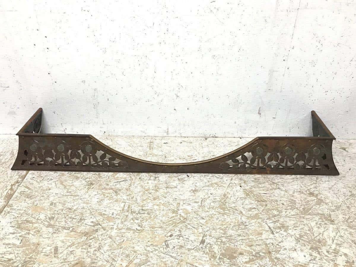 C R Ashbee, The Guild of Handicraft. Chipping Camden.
An English Arts & Crafts hand-made copper fireplace fender with stylized floral decoration and hand riveted construction.
