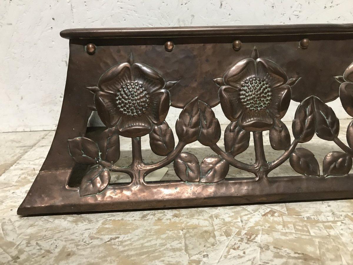 English C R Ashbee, an Arts & Crafts Copper Fireplace Fender with Stylised Floral Design