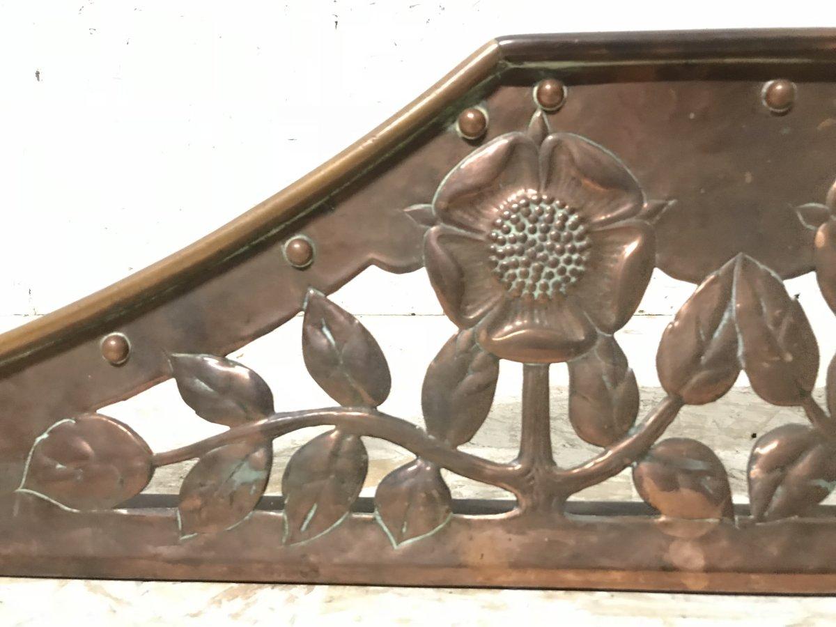 C R Ashbee, an Arts & Crafts Copper Fireplace Fender with Stylised Floral Design 1