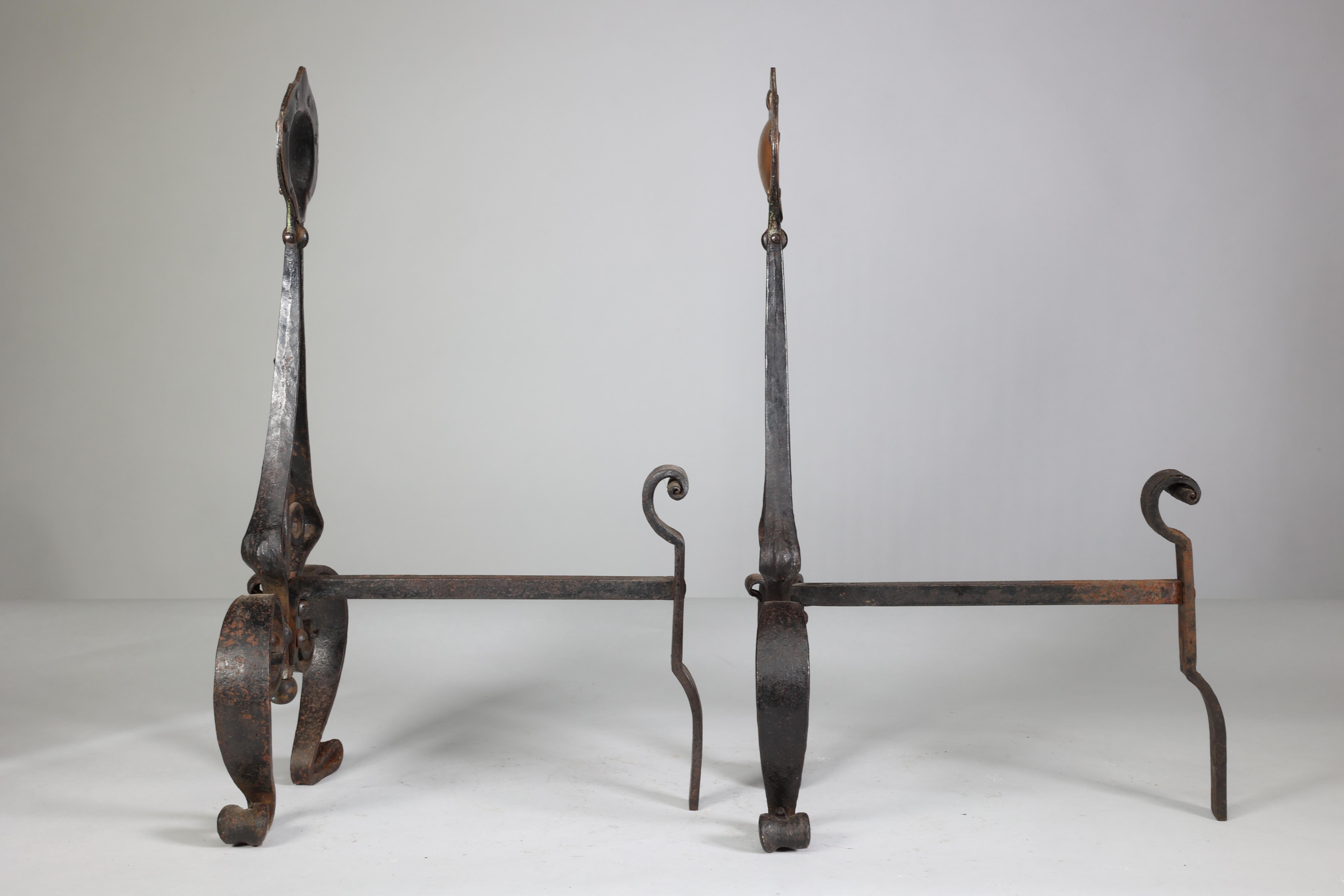 Wrought Iron C R Ashbee An early pair of Arts & Crafts hand wrought iron & copper fire dogs. For Sale