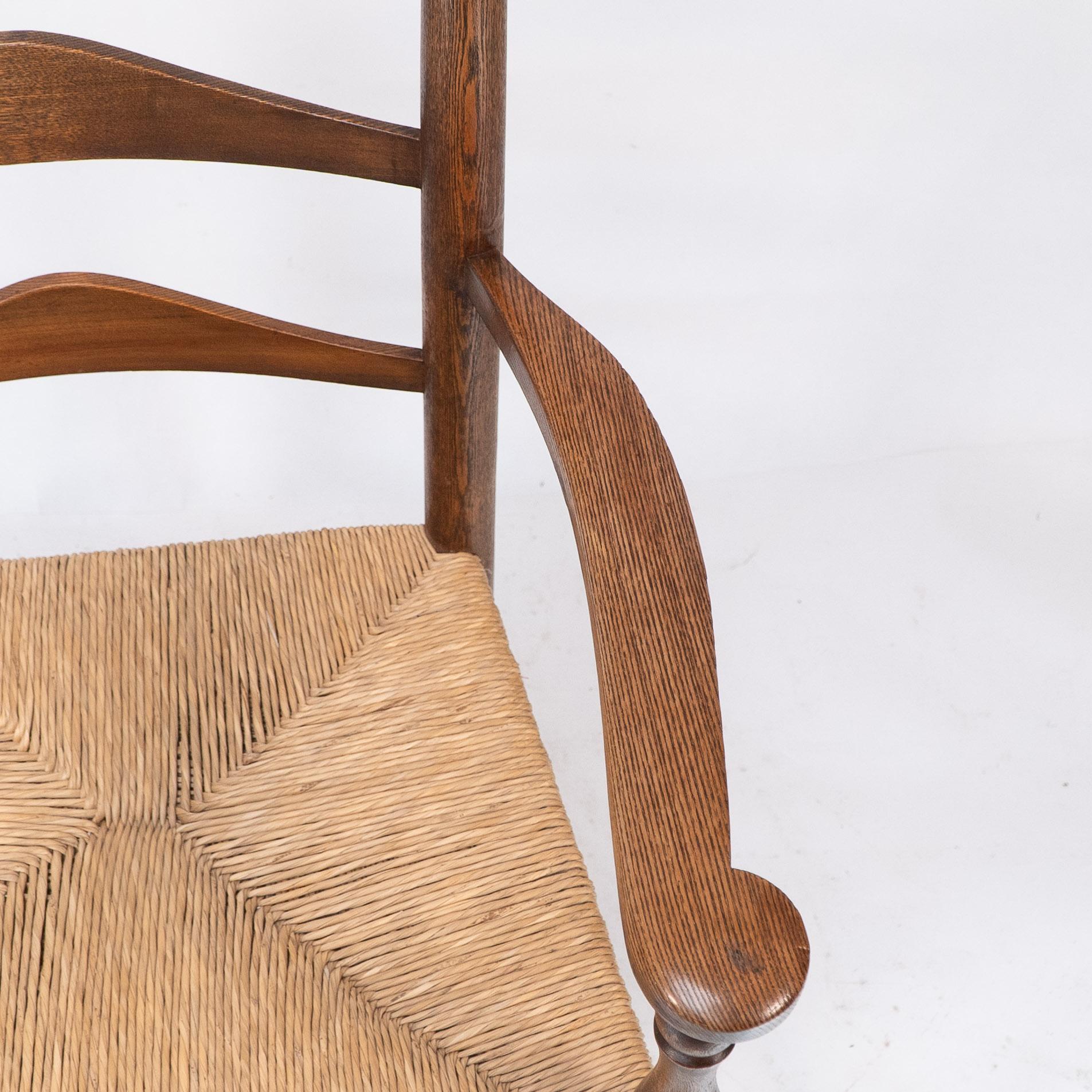 C. R. Ashbee attr. Un sillón Arts & Crafts con respaldo de escalera de roble y asiento reempotrado en venta 3