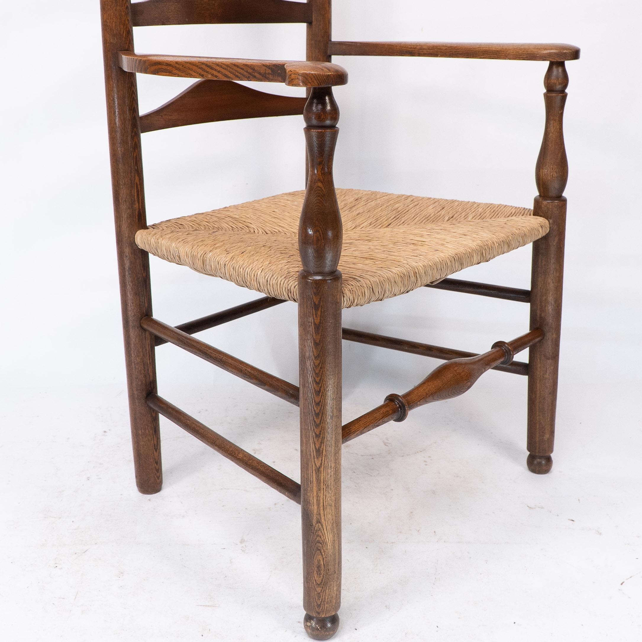 C R Ashbee attr. An Arts & Crafts oak ladder back armchair with re-rushed seat For Sale 3