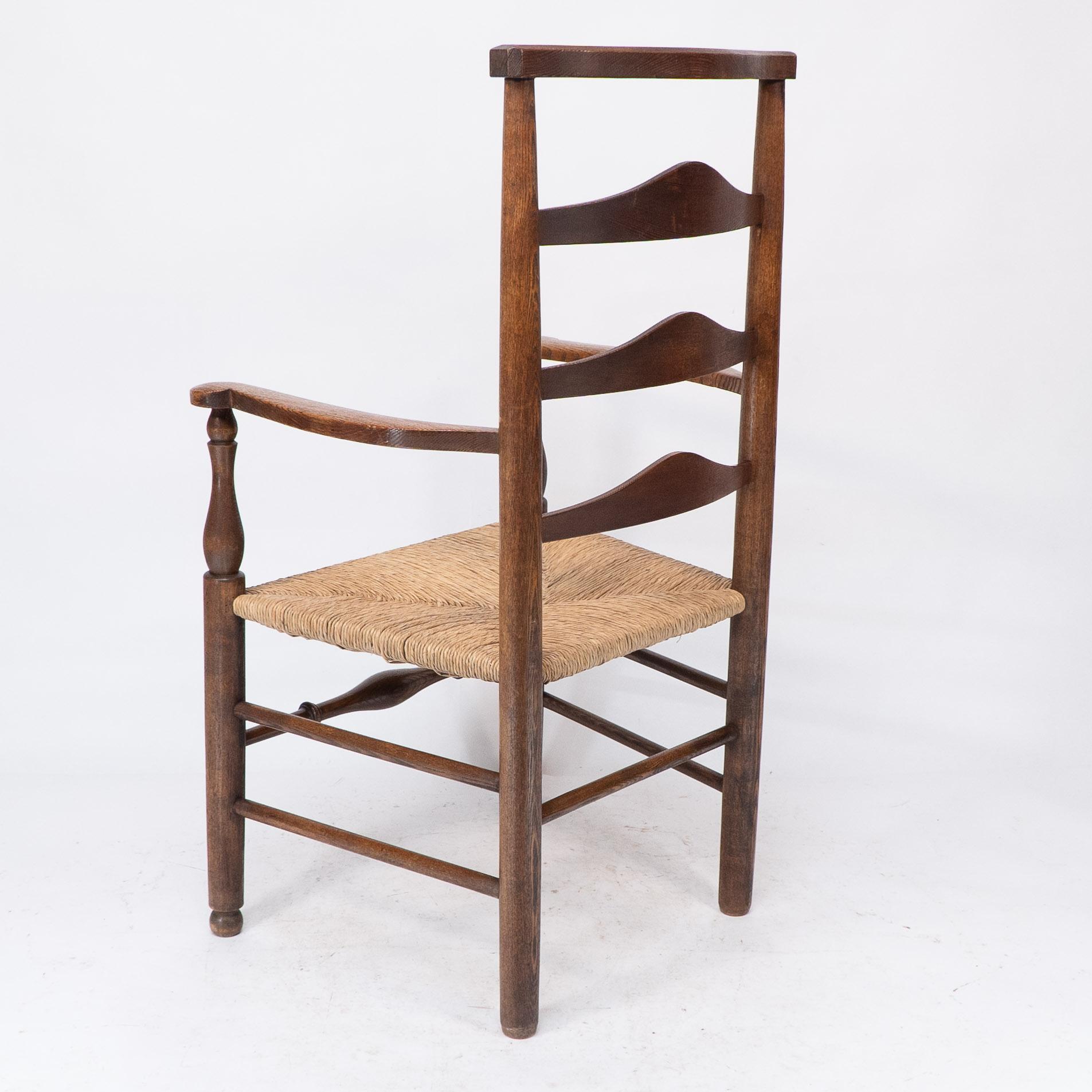 C R Ashbee attr. An Arts & Crafts oak ladder back armchair with re-rushed seat For Sale 9