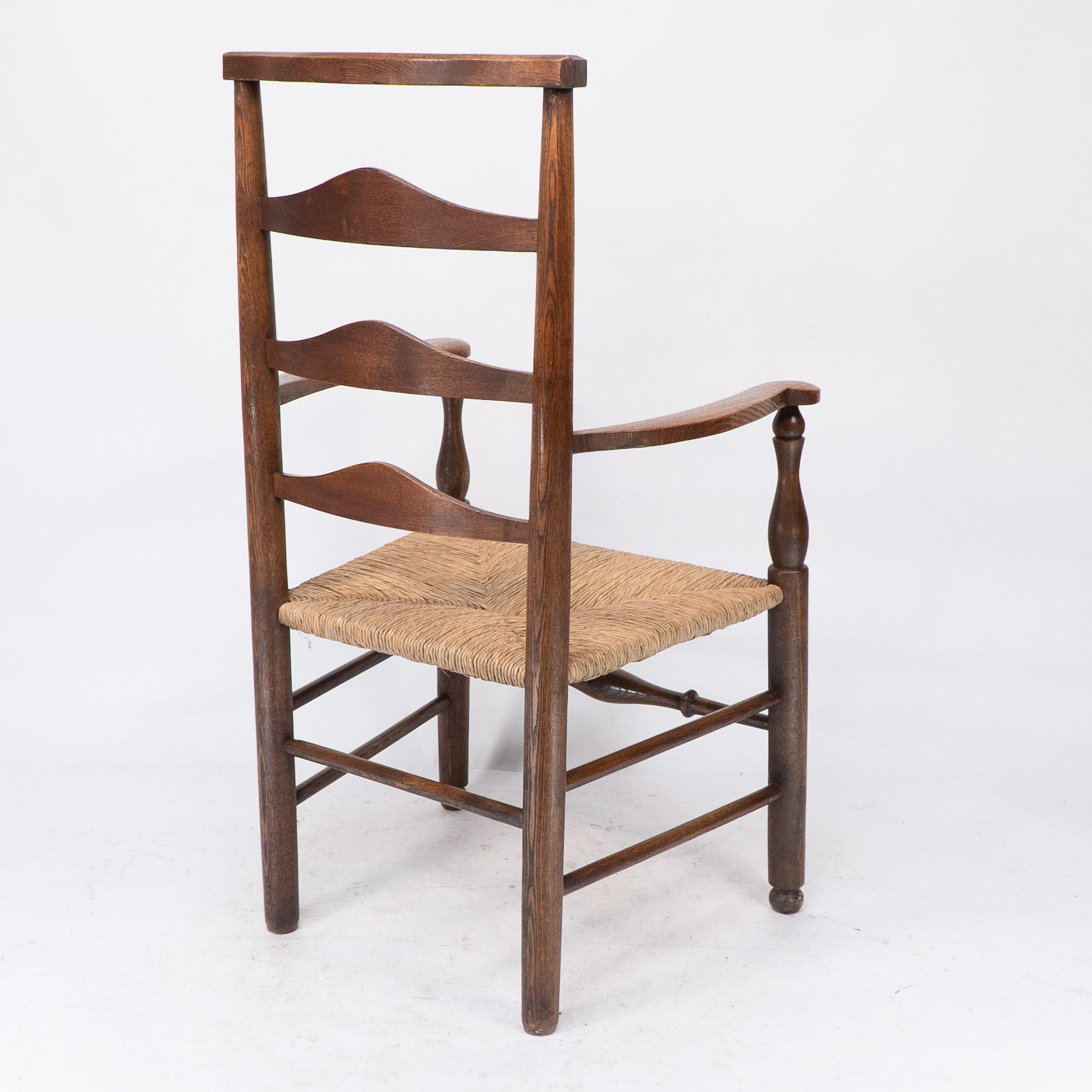 C R Ashbee attr. An Arts & Crafts oak ladder back armchair with re-rushed seat For Sale 11
