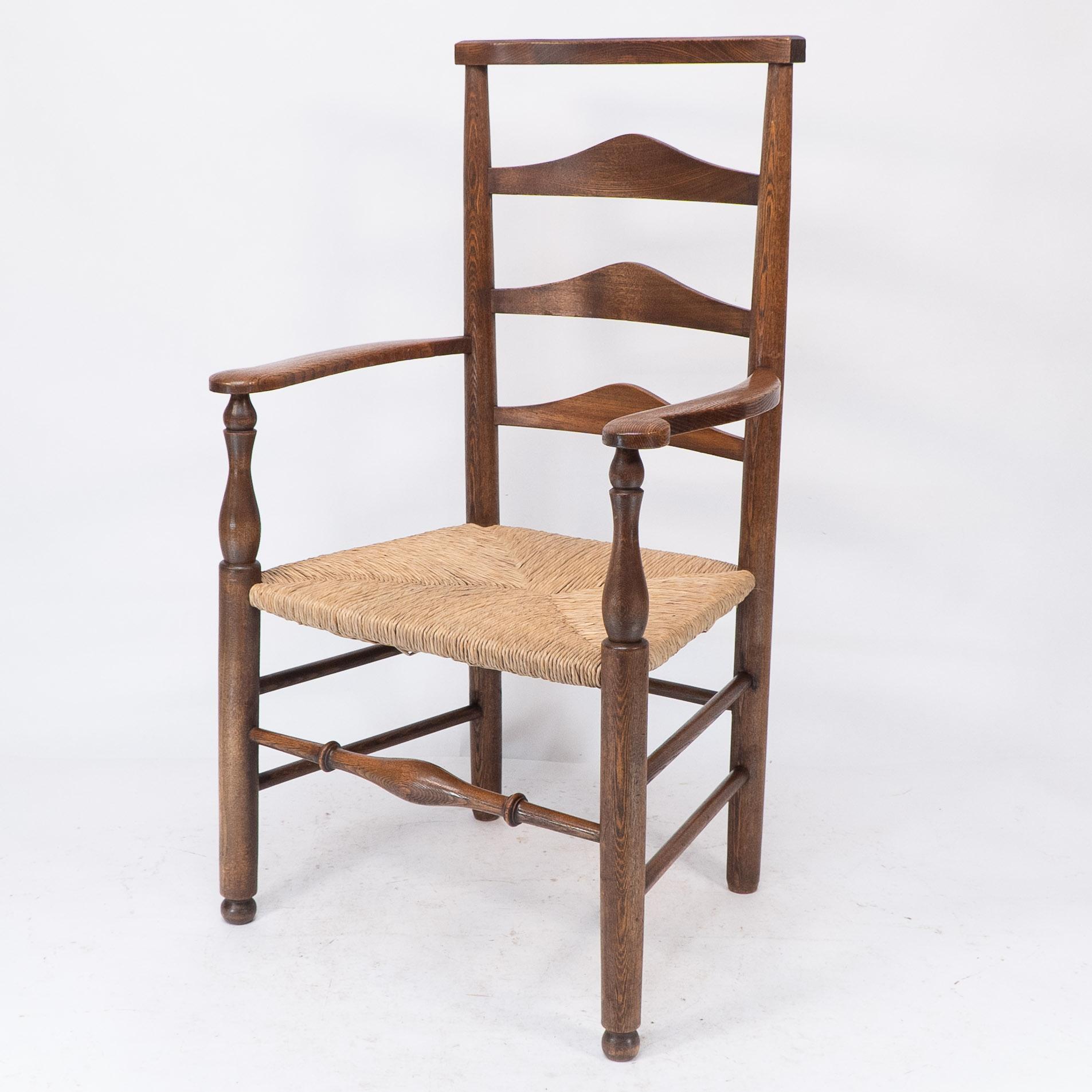 C. R. Ashbee attr. Un sillón Arts & Crafts con respaldo de escalera de roble y asiento reempotrado Artes y manualidades en venta