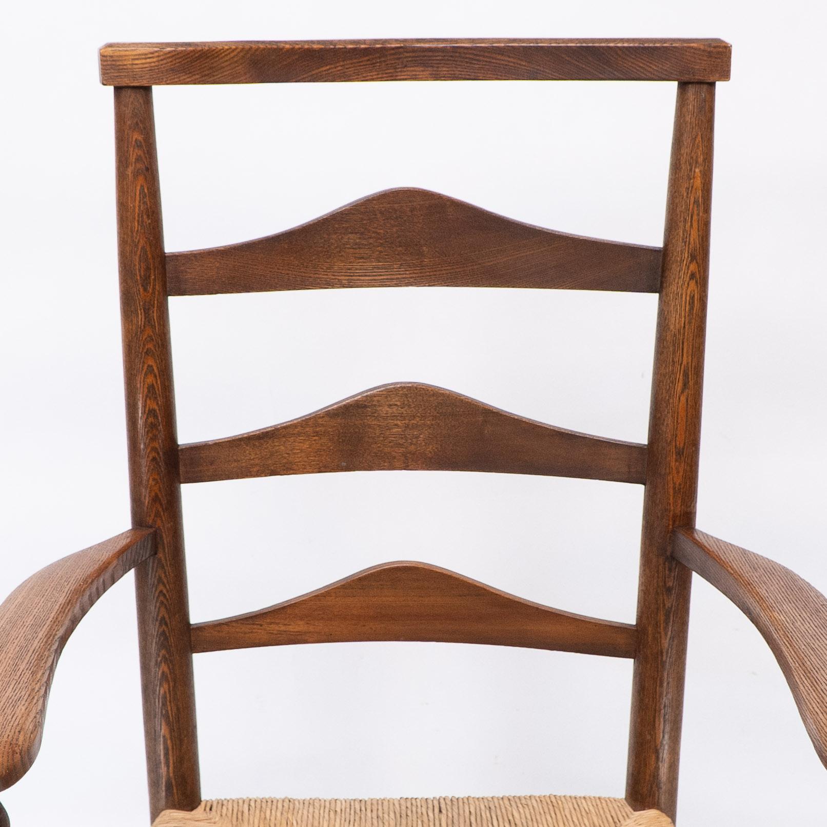 C R Ashbee attr. An Arts & Crafts oak ladder back armchair with re-rushed seat In Good Condition For Sale In London, GB