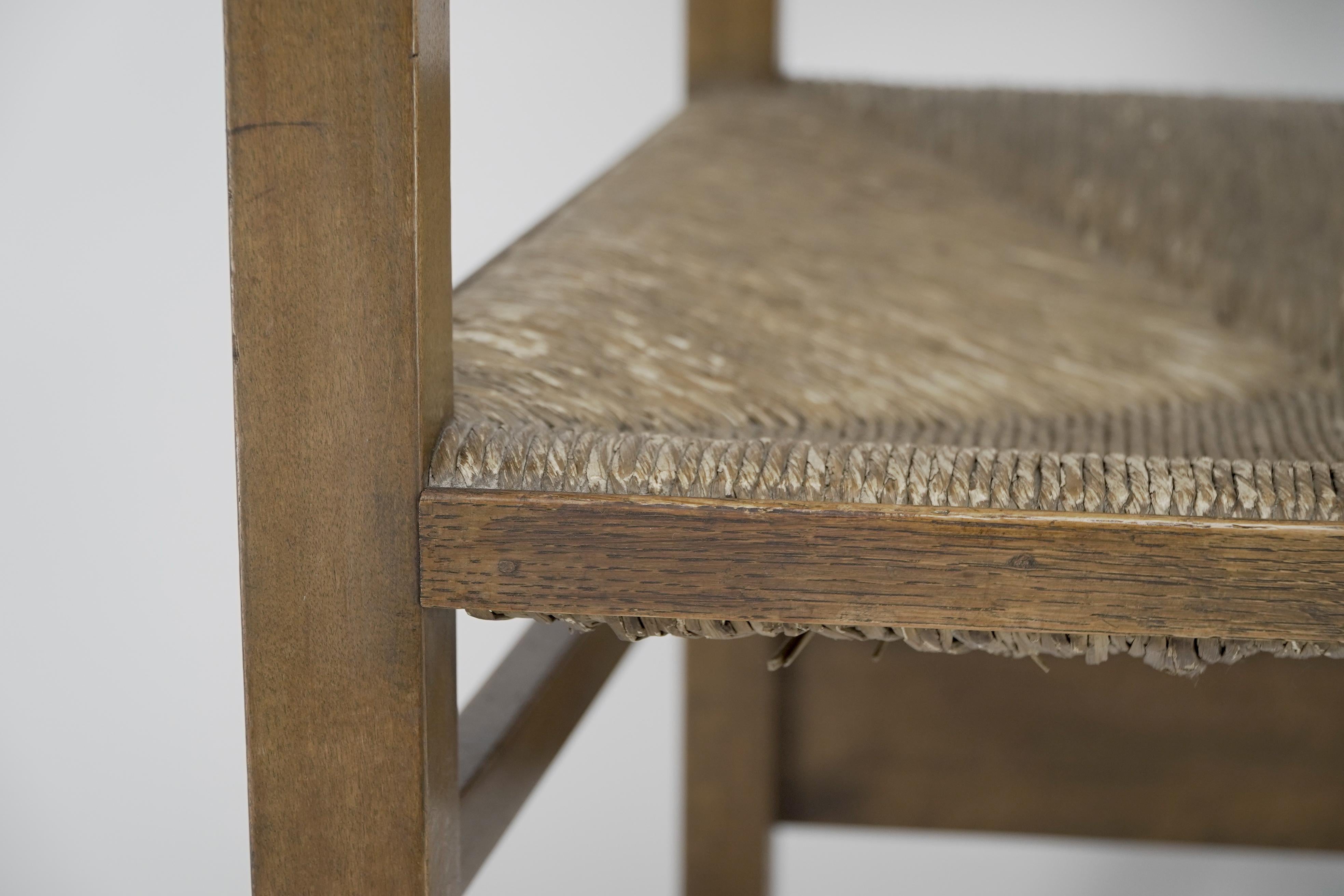 Baillie Scott for J P White. Arts & Crafts oak & rush seat ladder back armchair. For Sale 4